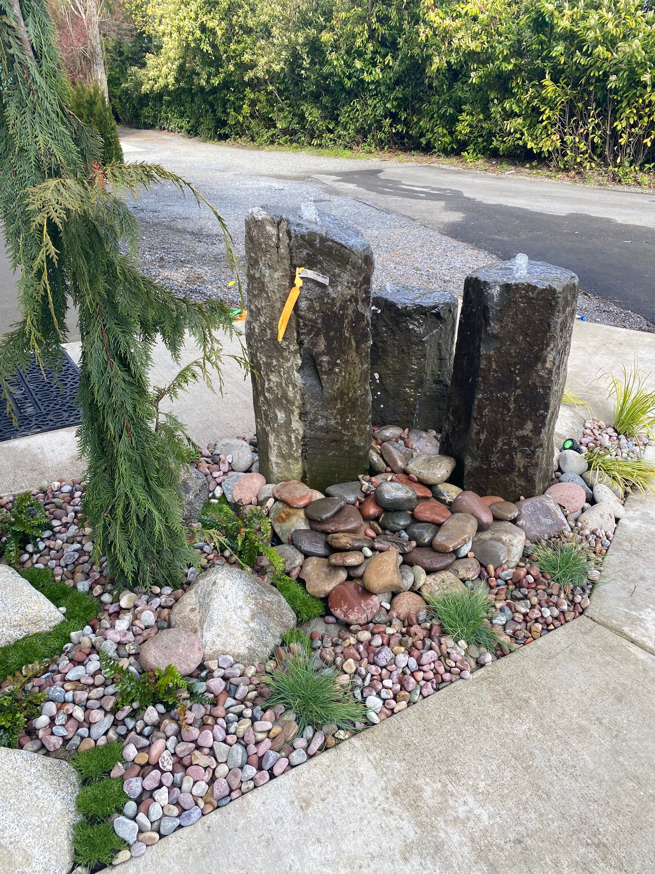 Patio Installation using Concrete, Retaining walls, and Turf install by Jireh Asphalt & Concrete Inc 