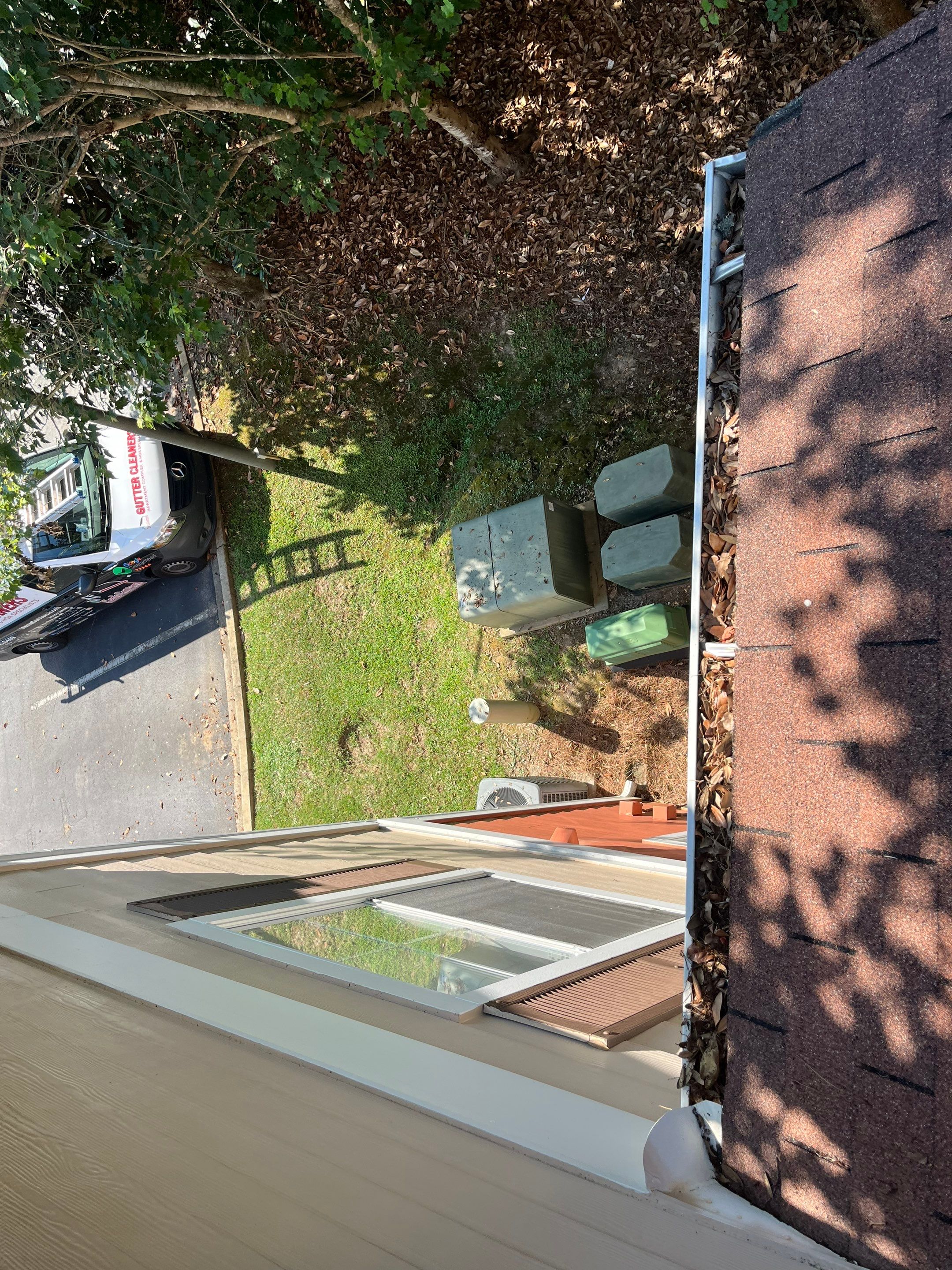 Commercial gutter cleaning Tallahassee, FL before photo with filled gutters