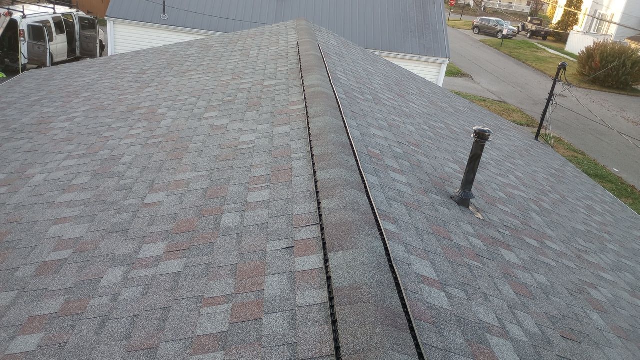Commercial Roofing Installation using Performance Shingles by Mr. Roofer