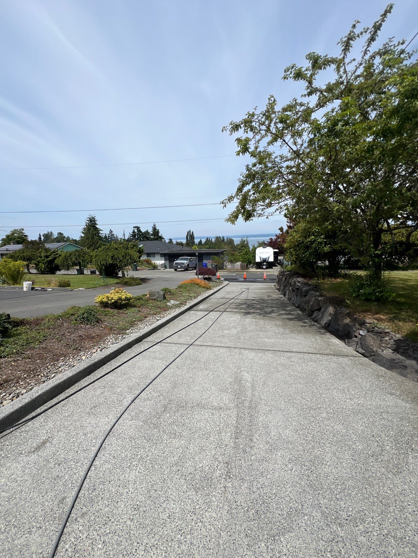 Concrete Driveway Makeover w/ Asphalt Patch | Everett  by Jireh Asphalt & Concrete Inc 