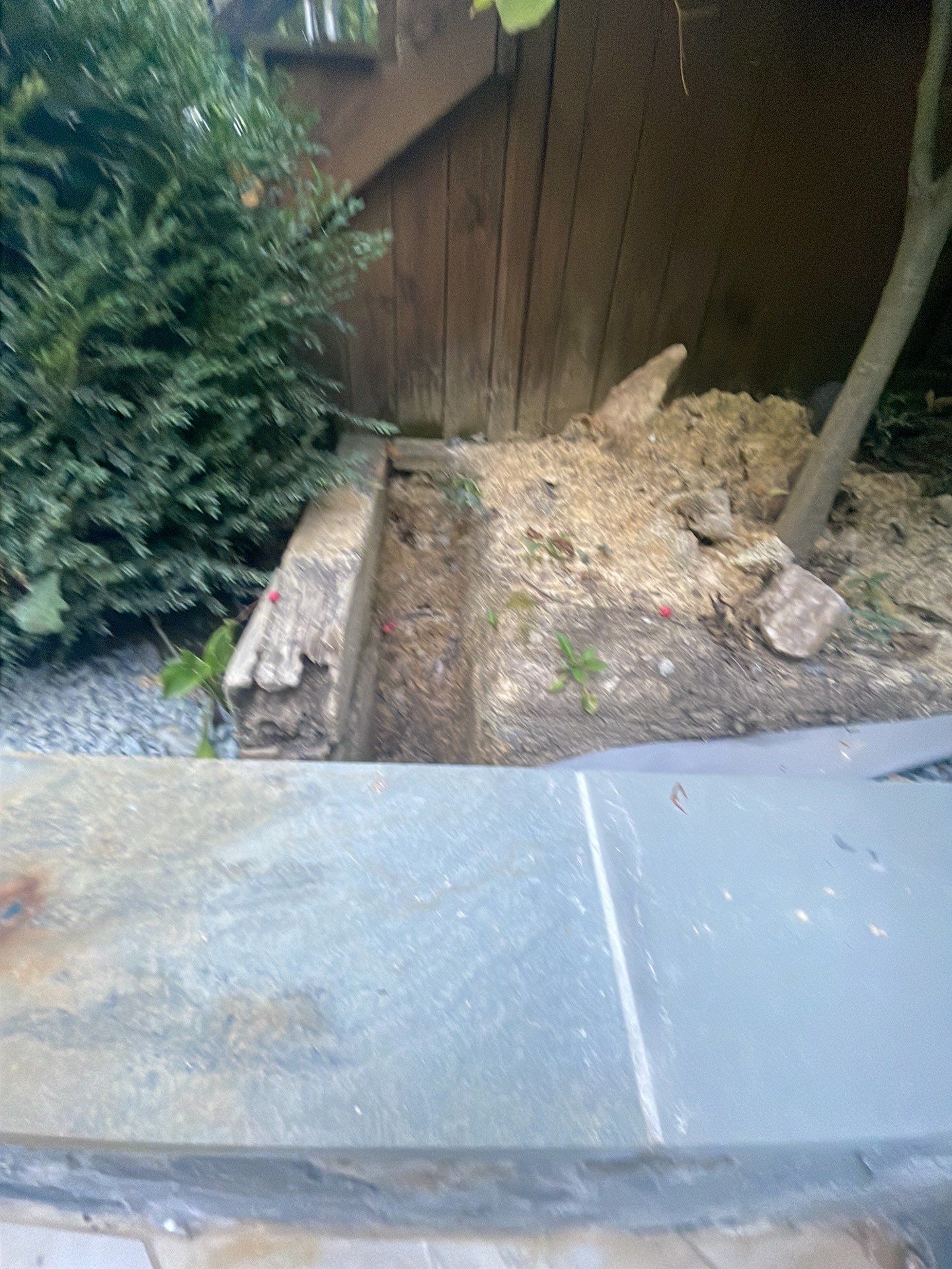 Pool Surround remodel with retaining walls, new waterfall and water slide by Fairfax Contractors, LLC