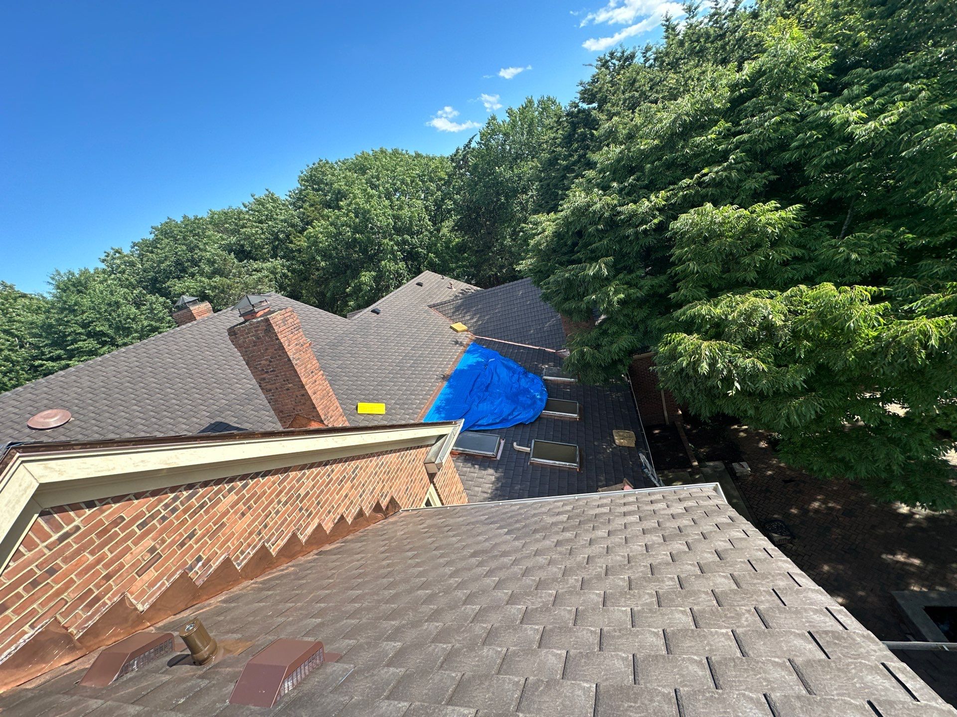Residential Roofing Installation Using Enviroshake Synthetic Slate by Undersun Roofing 