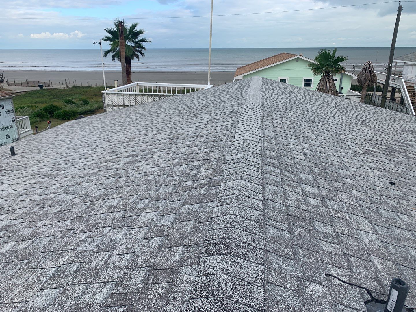 Galveston Waterfront Roof Installation In Progress by Elite Roofing LLC