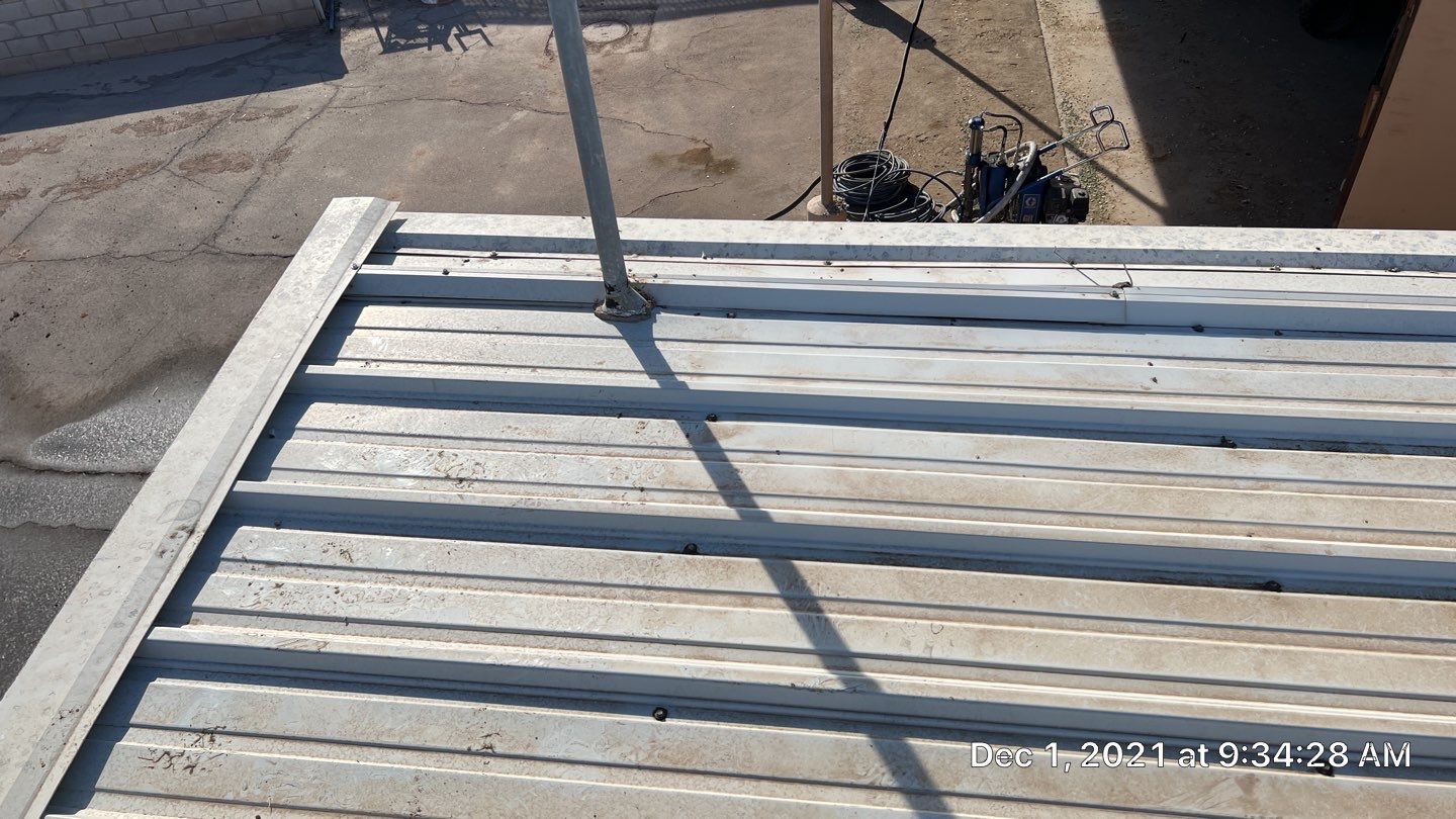 Metal roof restoration on commercial roof using Conklin Benchmark/PUMA XL fabric and coating by Straight Edge Roofing Inc