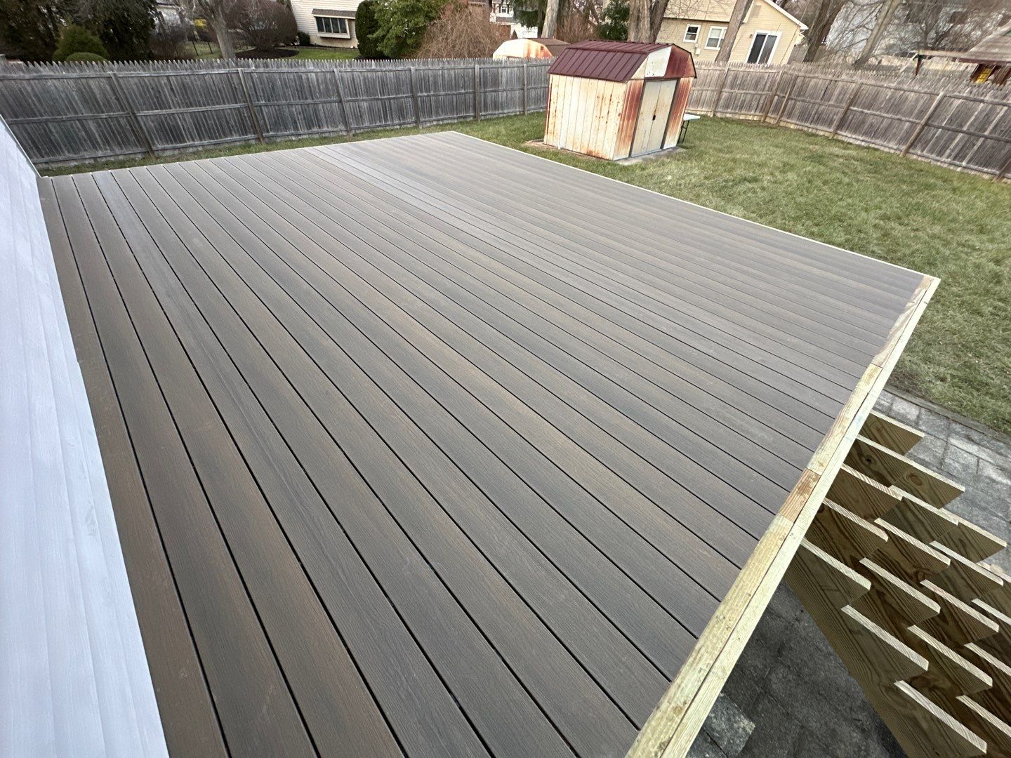 New deck construction and replacement of window with new sliding door  by deck guardian