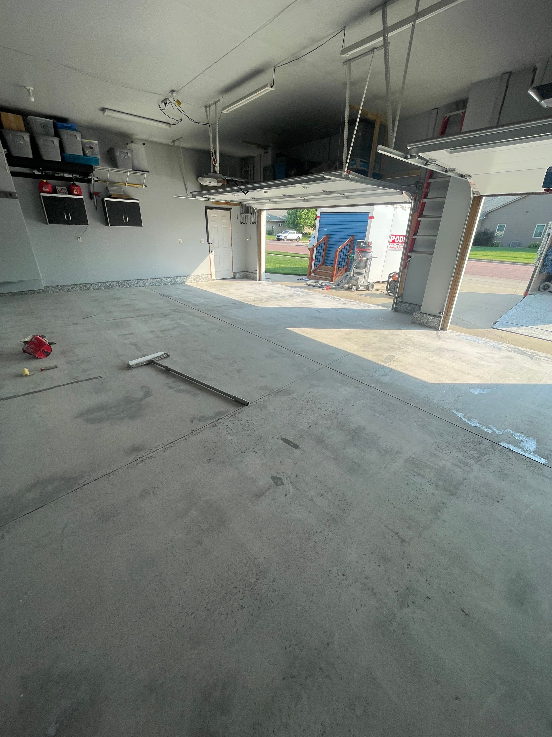 Sioux Falls Garage Concrete Coating Installation with Domino Flake by Select Painting, Coatings & Garage Cabinets