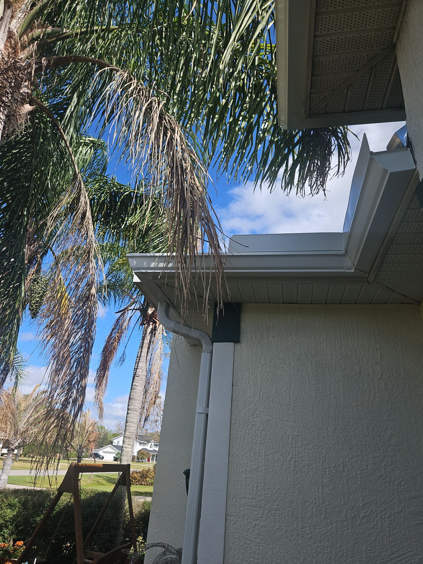 White seamless Gutters and downspout repair in Sarasota FL by Gutter Professors