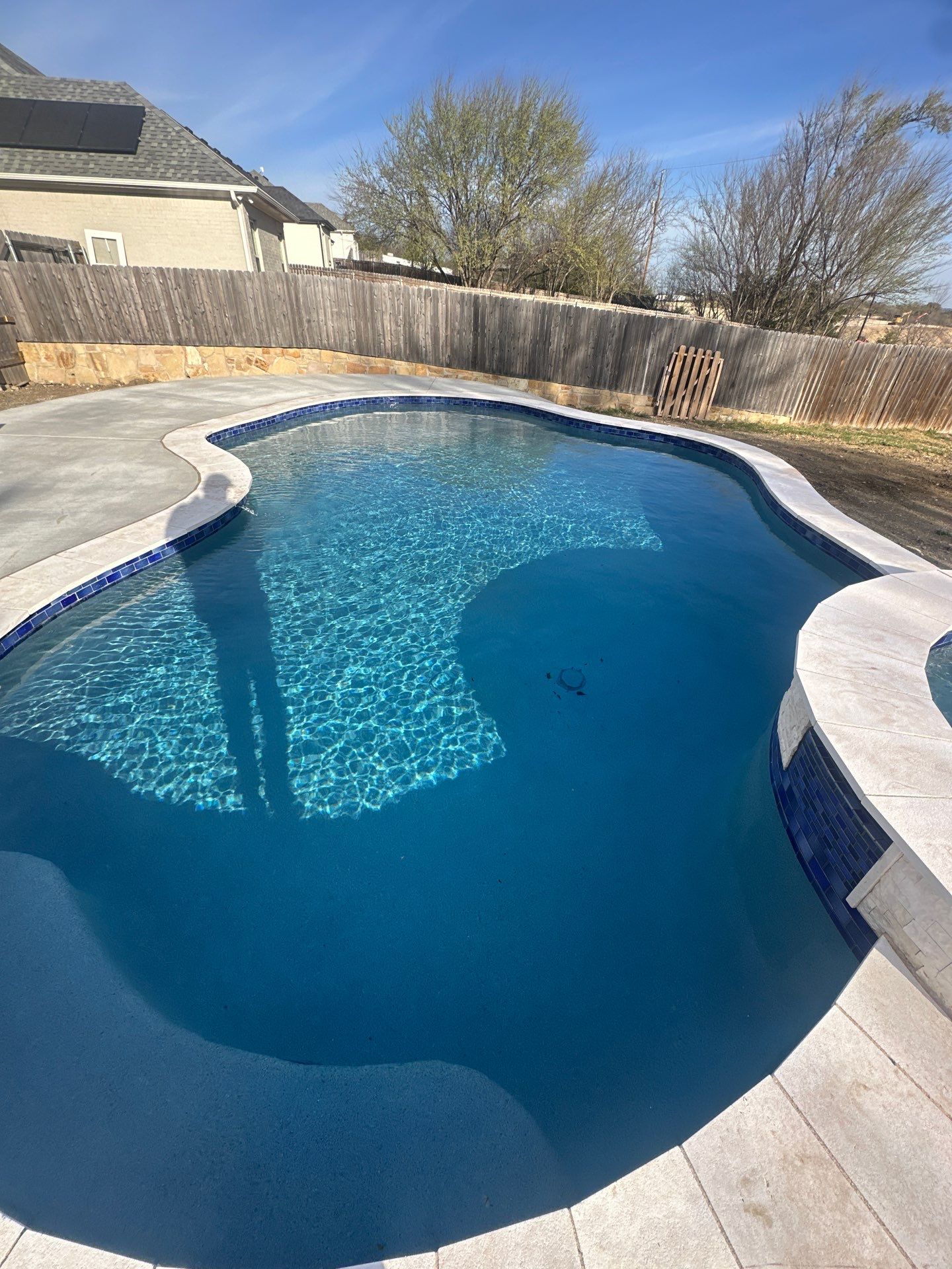 Freeform Pool with Raised Spa and Water Feature by Pinnacle Pools and Spas - DFW