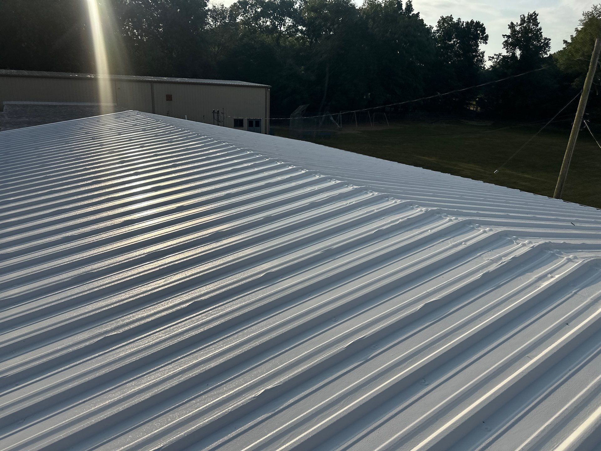 Commercial Roofing Install - Metal Coatings Restoration System  - Color White  by Titan Commercial & Residential Roofing 