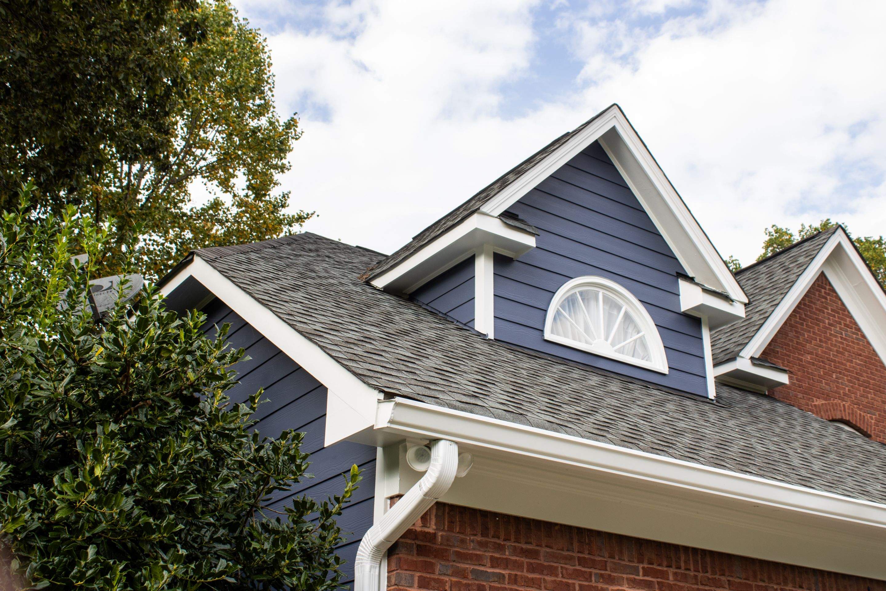 Blue Exterior Paint and Siding Installation using James Hardie Lap Siding by Nelson Exteriors