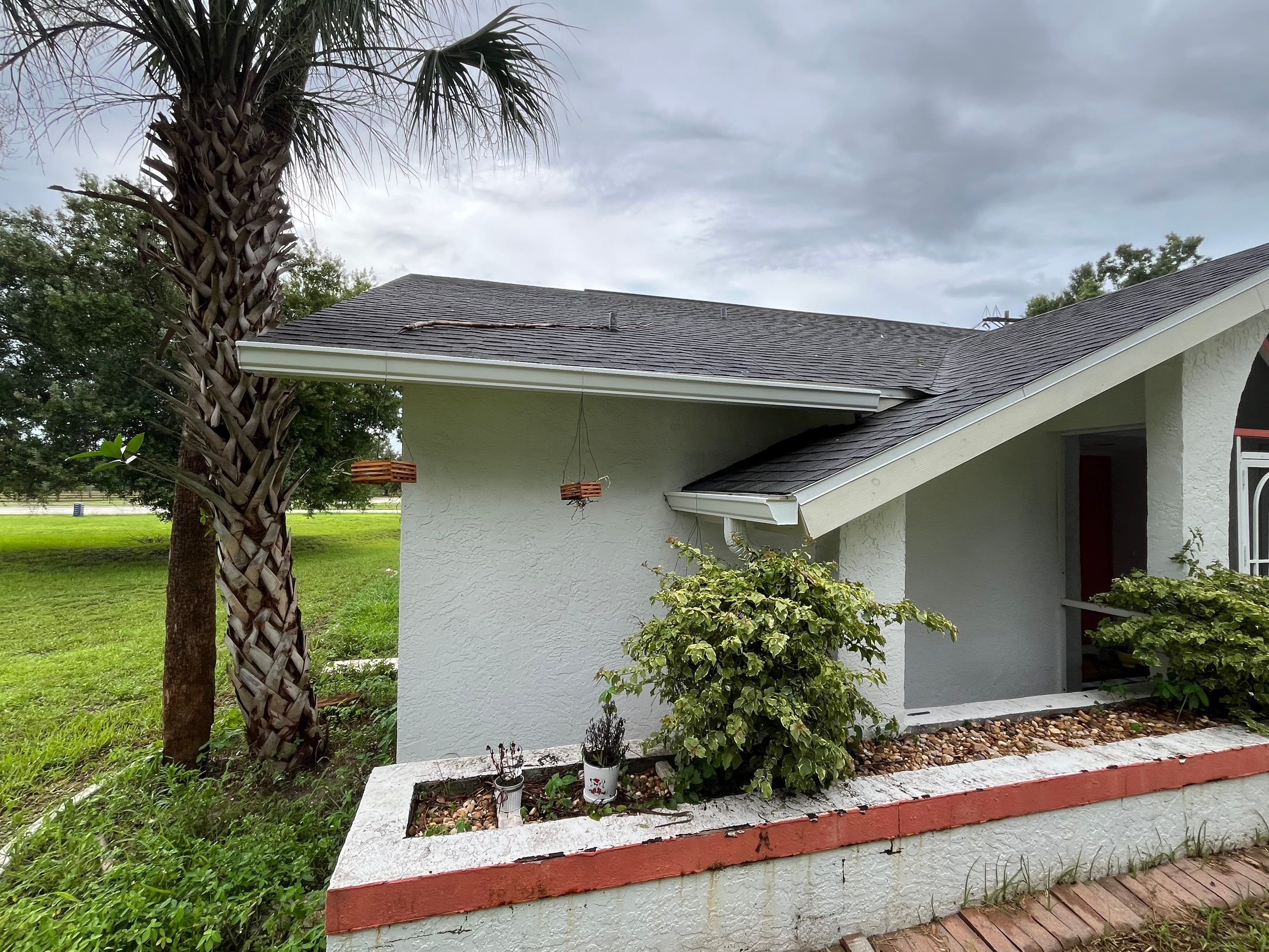 White Seamless Gutters with Splash Guards in North Fort Myers FL by Gutter Professor   by Gutter Professors