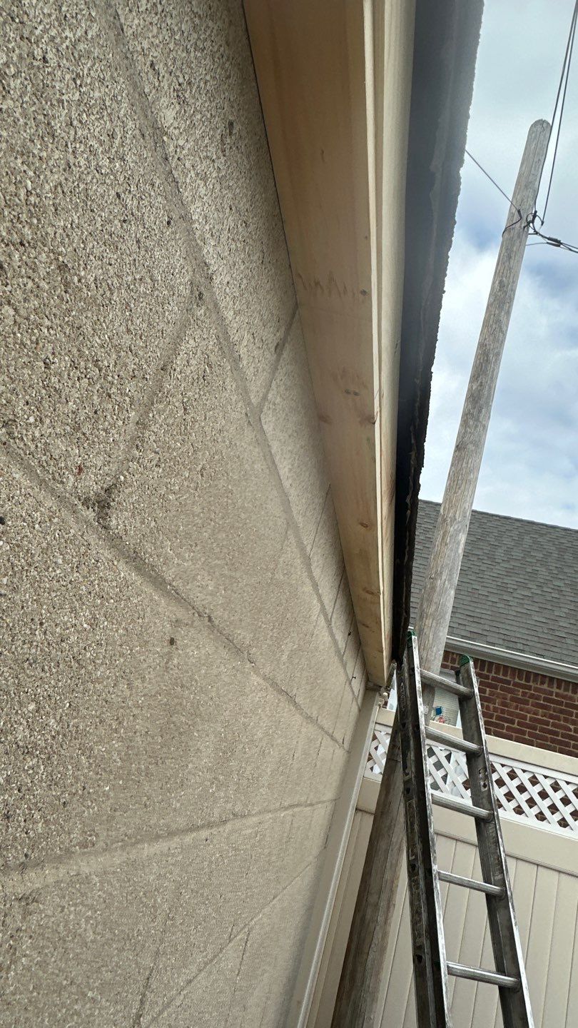 Queens Garage Fascia Rebuild + New 5" Seamless Gutter by Above All Gutters