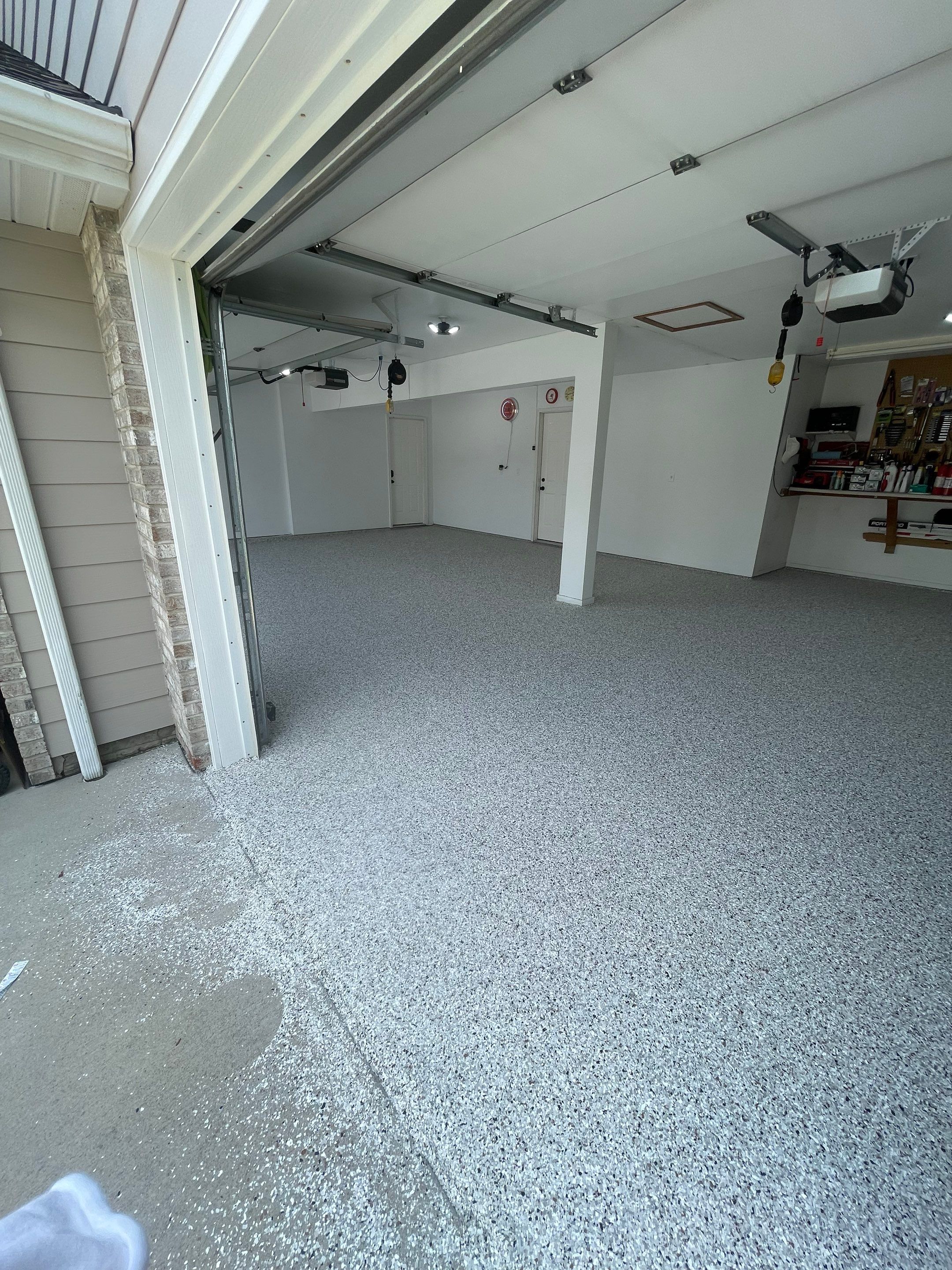 Multi-Car Garage Concrete Coating with Coyote Flake Finish in Sioux Falls by Select Painting, Coatings & Garage Cabinets