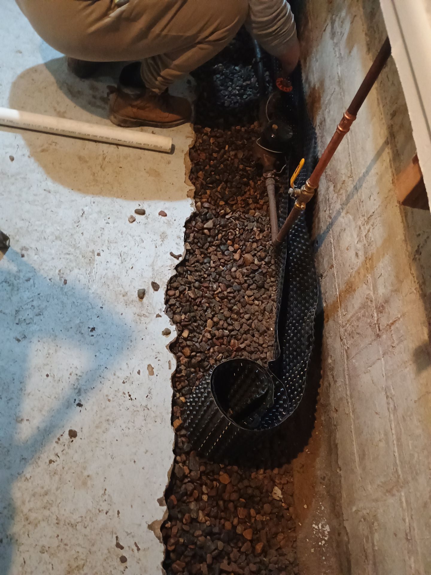 Interior Drain Tile & Sump Pump Installation in St. Paul, MN by Waterproofing Northeast