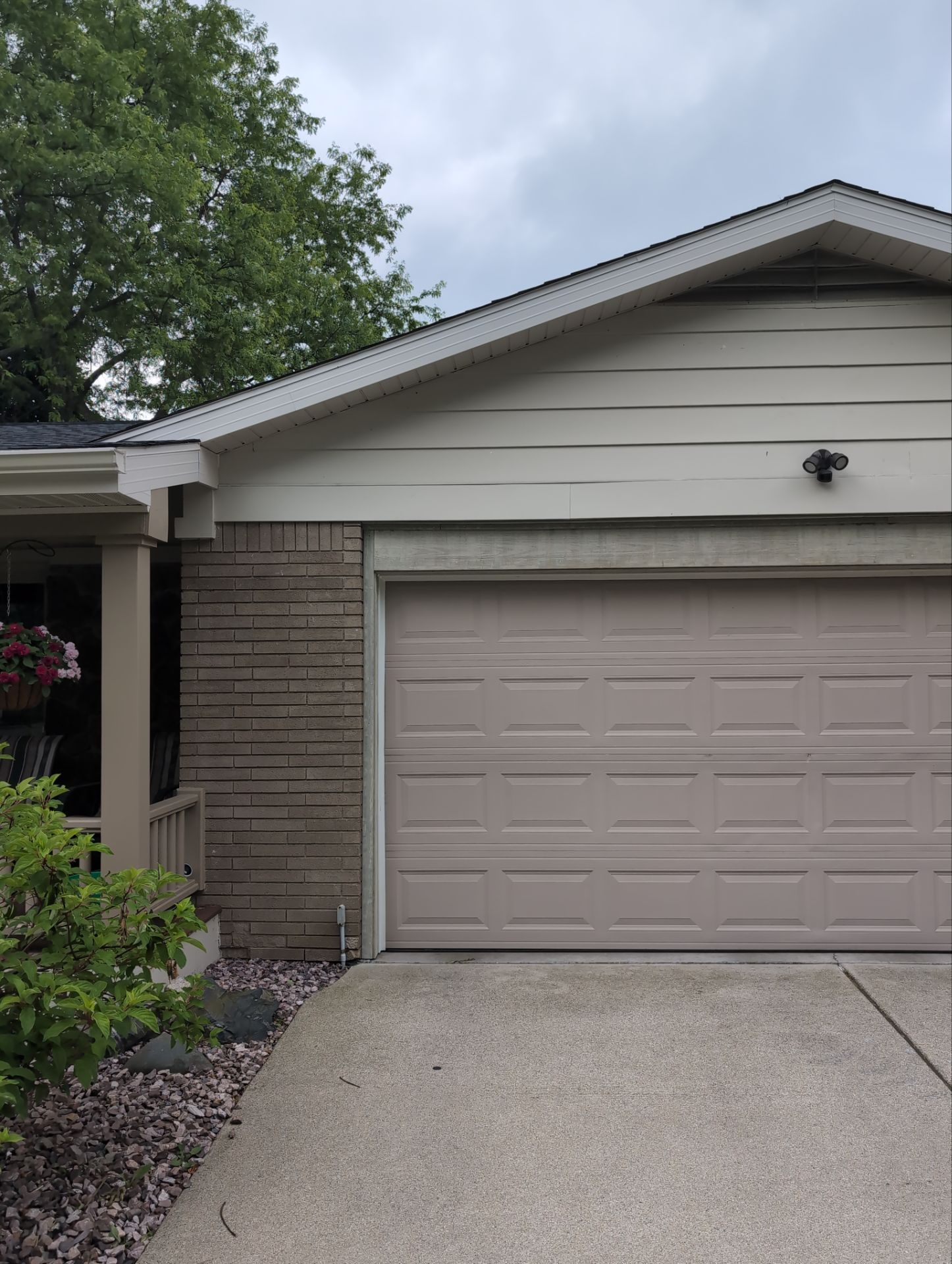 Installing new Roof, Fascia, Soffit, and Gutters. New custom trim around garage door. by Acme Exteriors