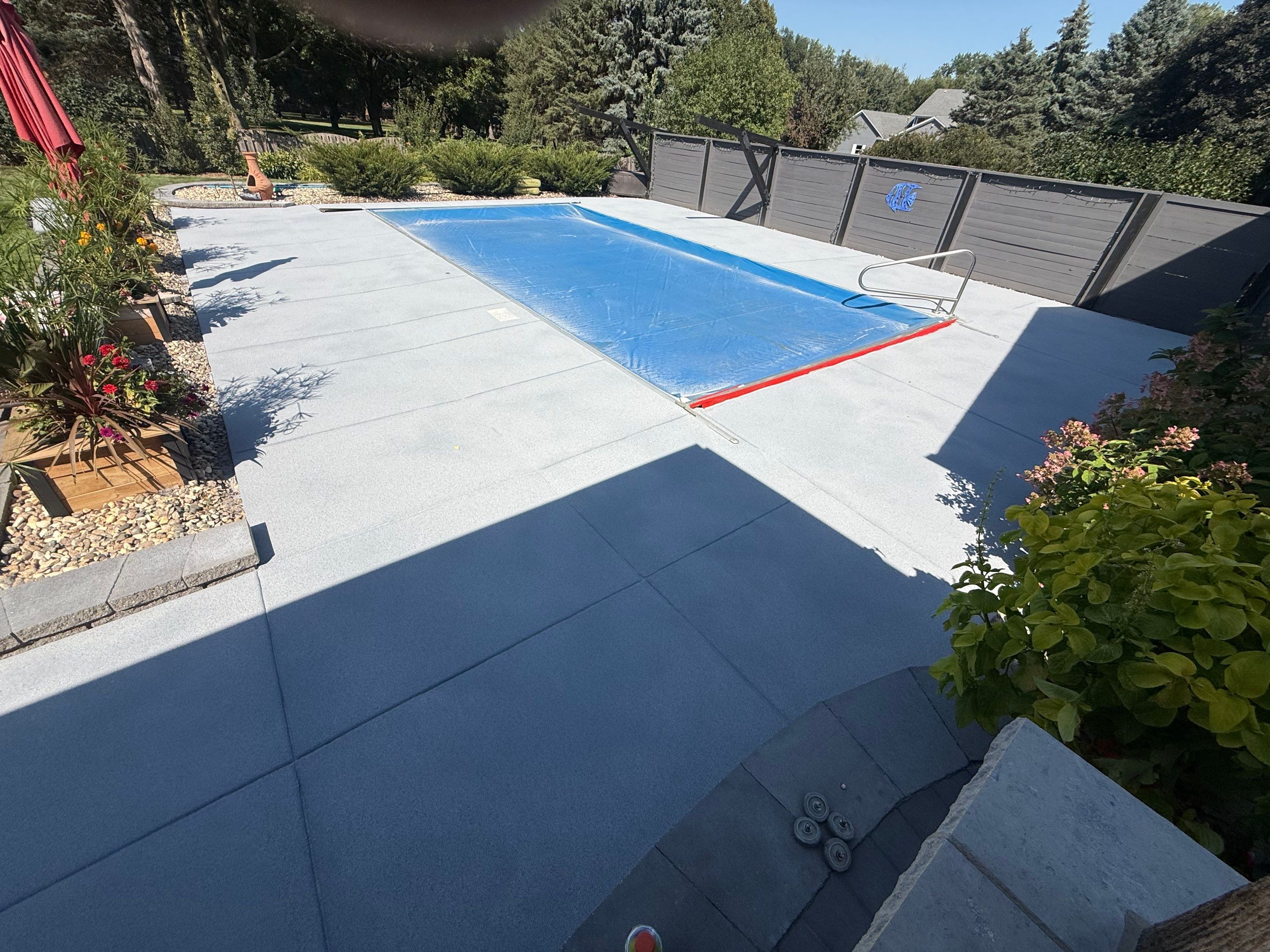Garage Floor and Textured Pool Deck Coating in Sioux Falls by Select Painting, Coatings & Garage Cabinets
