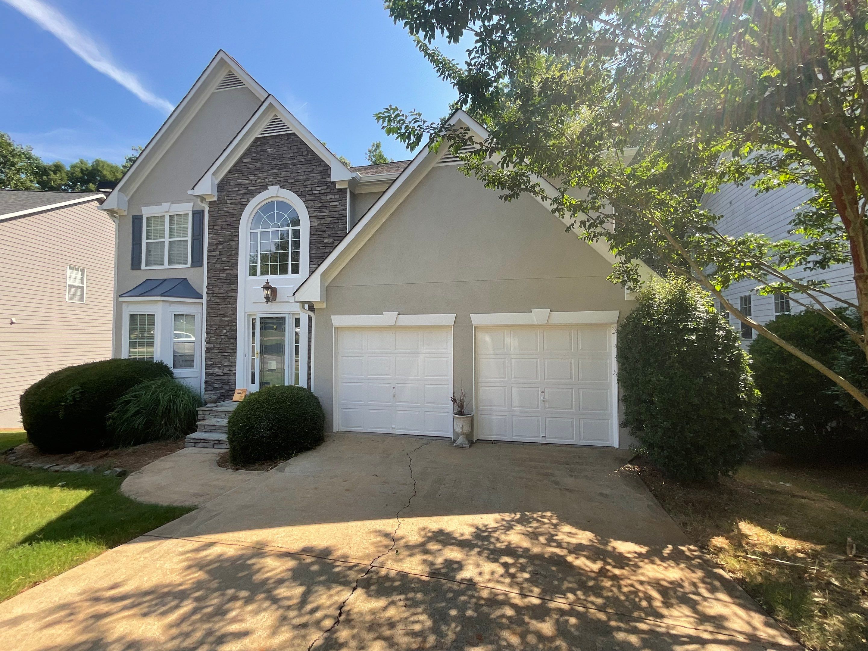Stucco and Siding Exterior Painting with New Gutters in Kennesaw by Swift Home Renovations