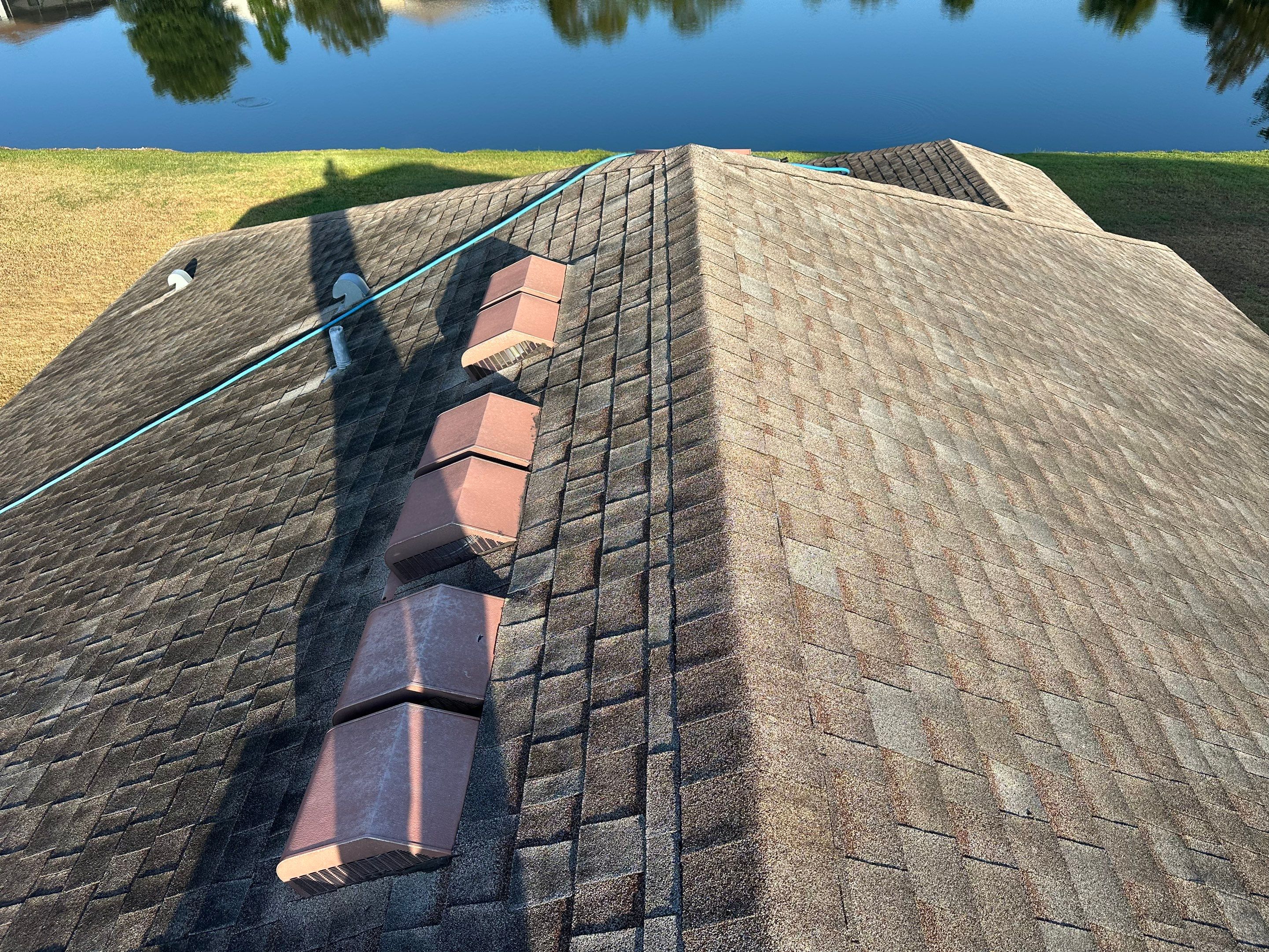 Asphalt Shingle Roof Soft Wash Cleaning & Concrete Pressure Washing in CopperStone Community, Parrish, FL by Sunshine AquaWash