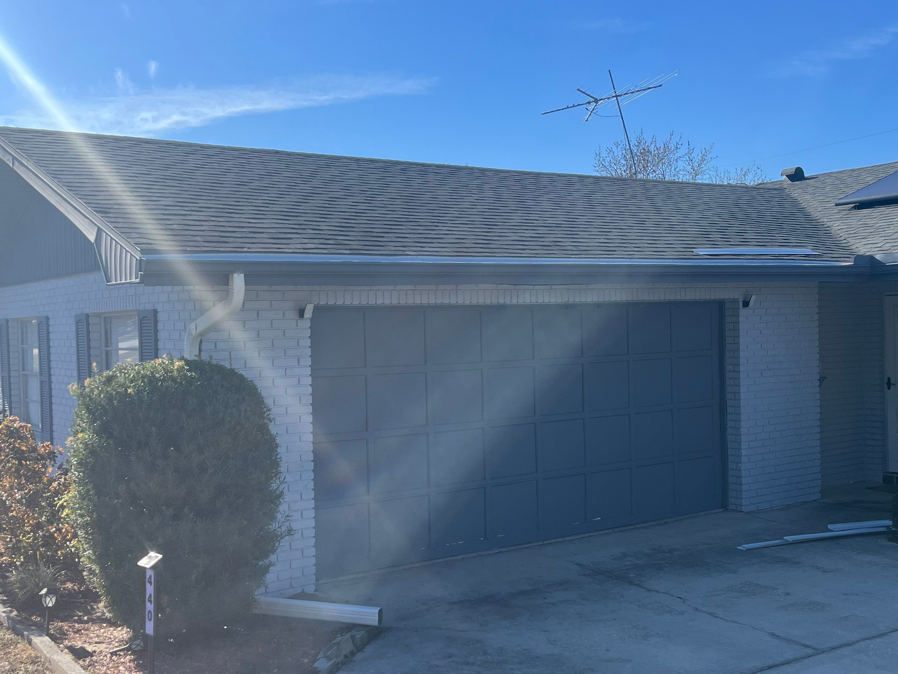 Downspout Installation using Downspout Extension and new Gutters in Winter Haven FL by Gutter Professors