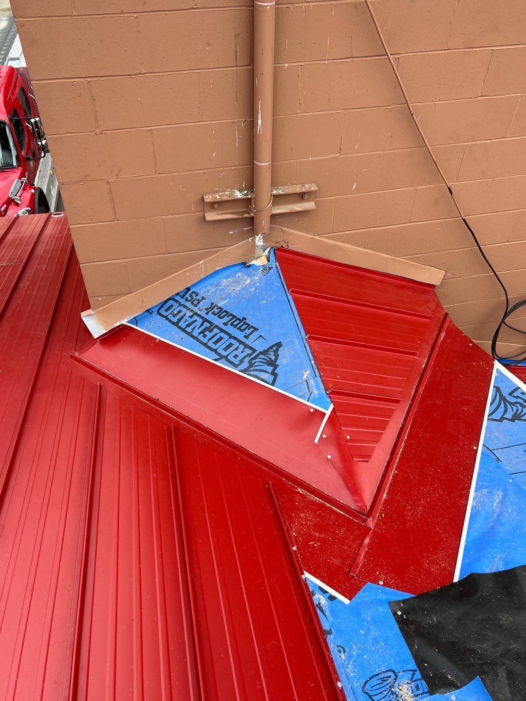 Commercial Roofing Installation using 12" Prolok metal  by Top Notch Roofing Inc