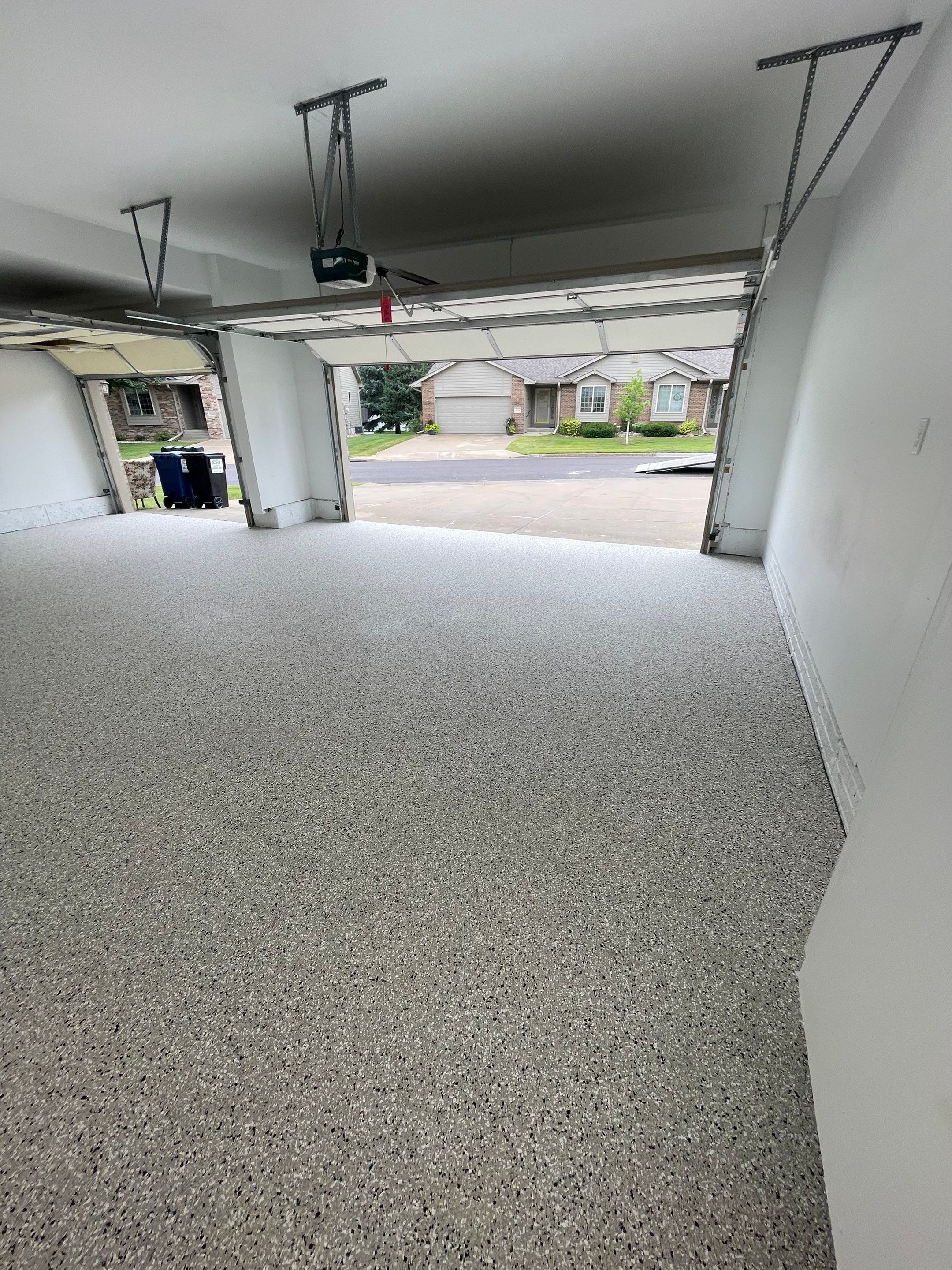 Cabin Fever Garage Floor System in Sioux Falls by Select Painting, Coatings & Garage Cabinets