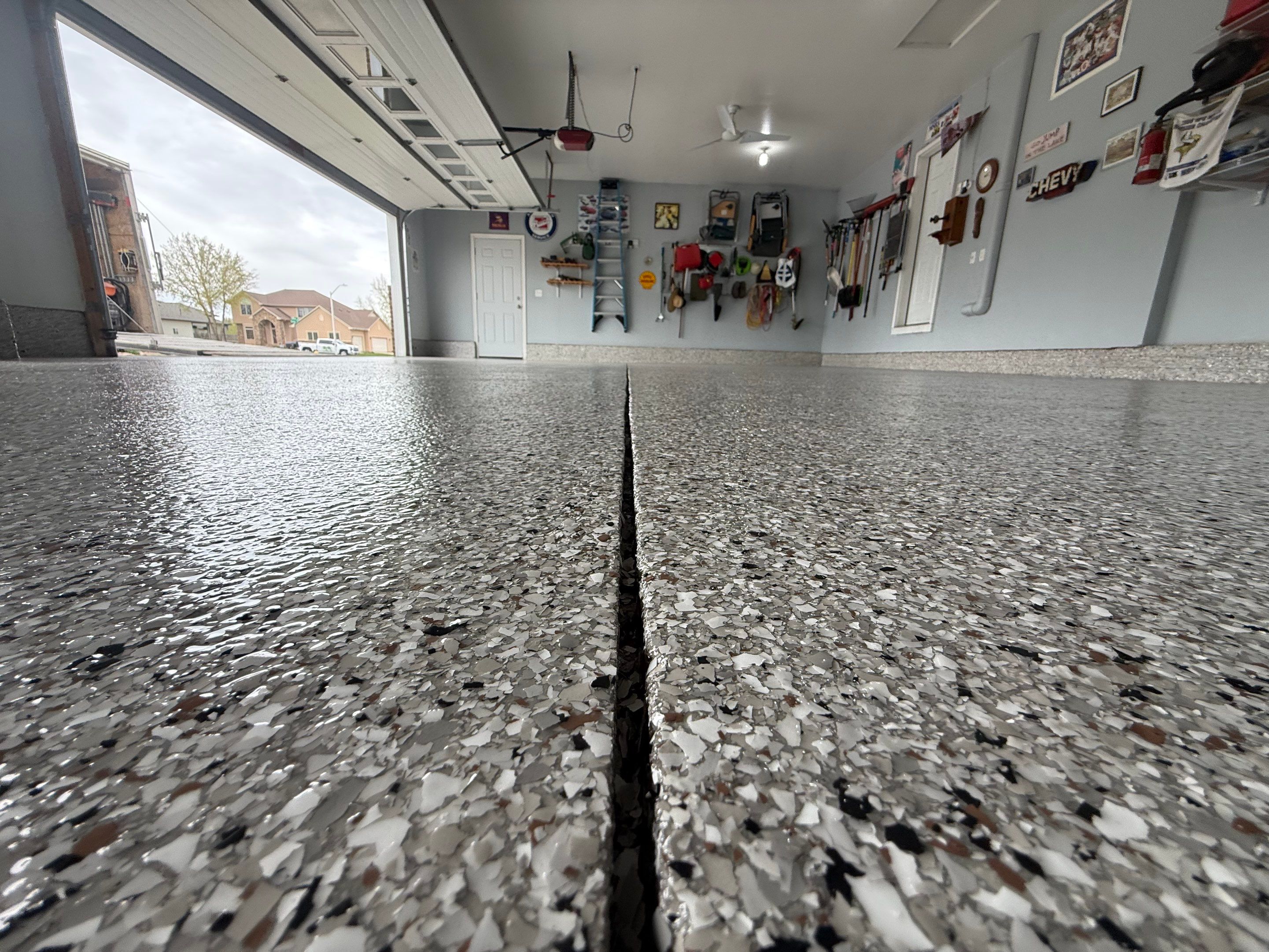 High-Gloss Epoxy Garage Floor Coating in Sioux Falls by Select Painting, Coatings & Garage Cabinets