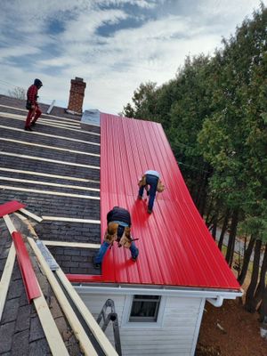 Residential Roof Installation with Red Pro Rib Metal Roofing in Adell, WI