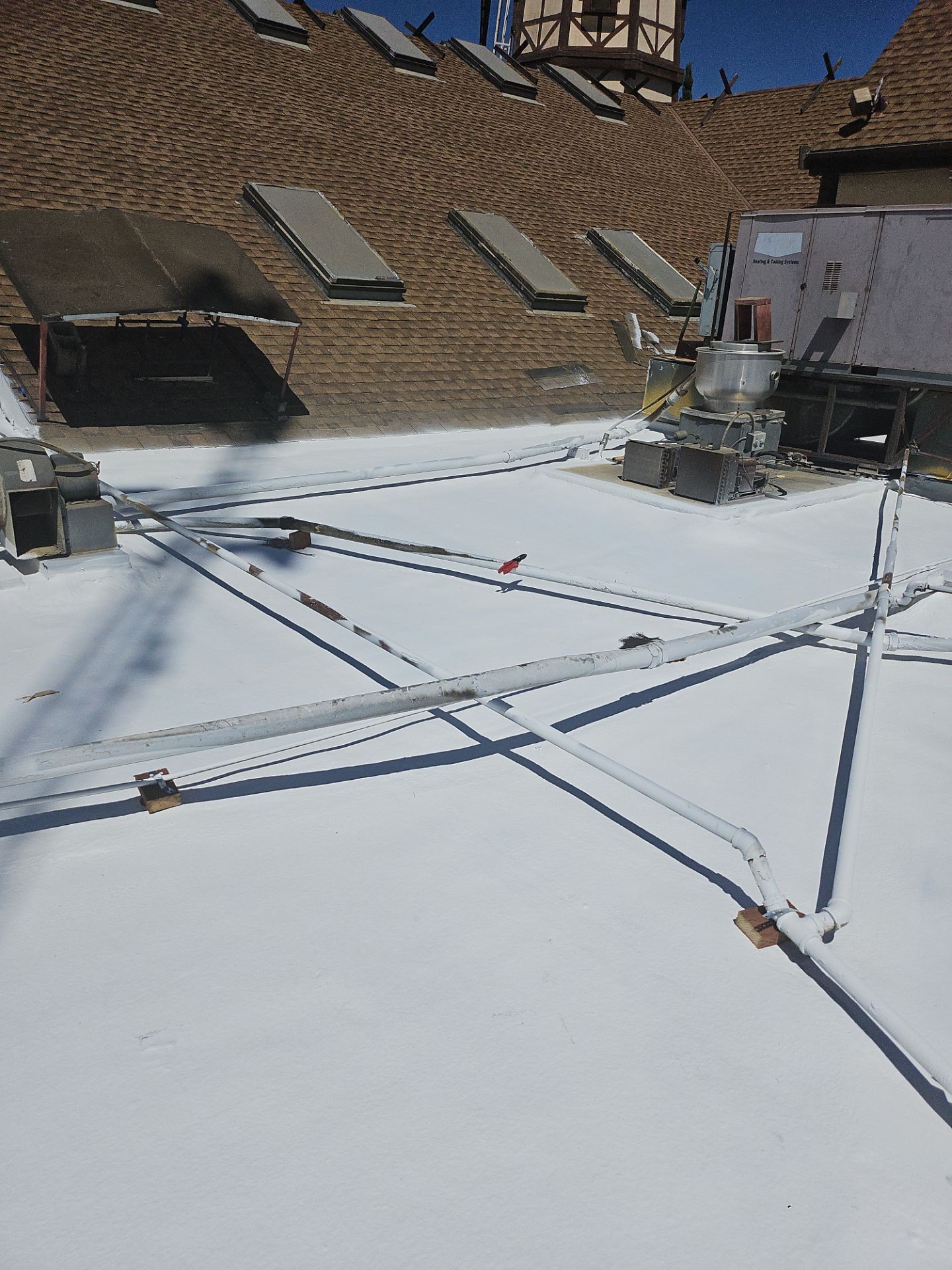 Spray foam and coatings using General Coatings acrylic coatings and spray foam by Straight Edge Roofing Inc