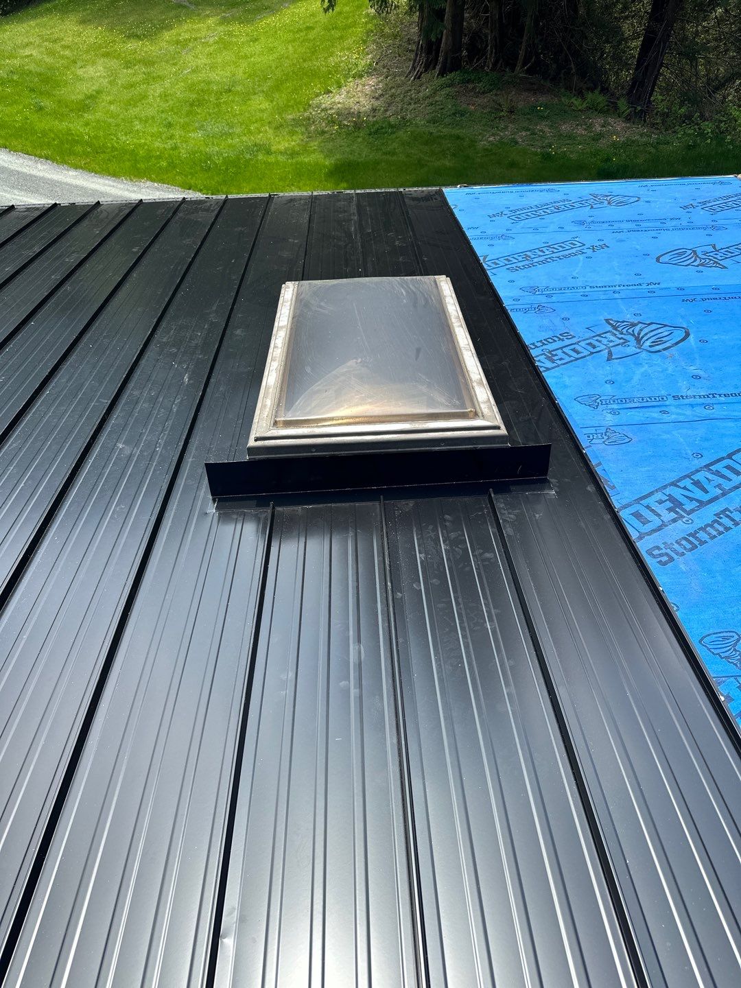 Residential ReRoofing Installation using 12" Prolok metal by Top Notch Roofing Inc