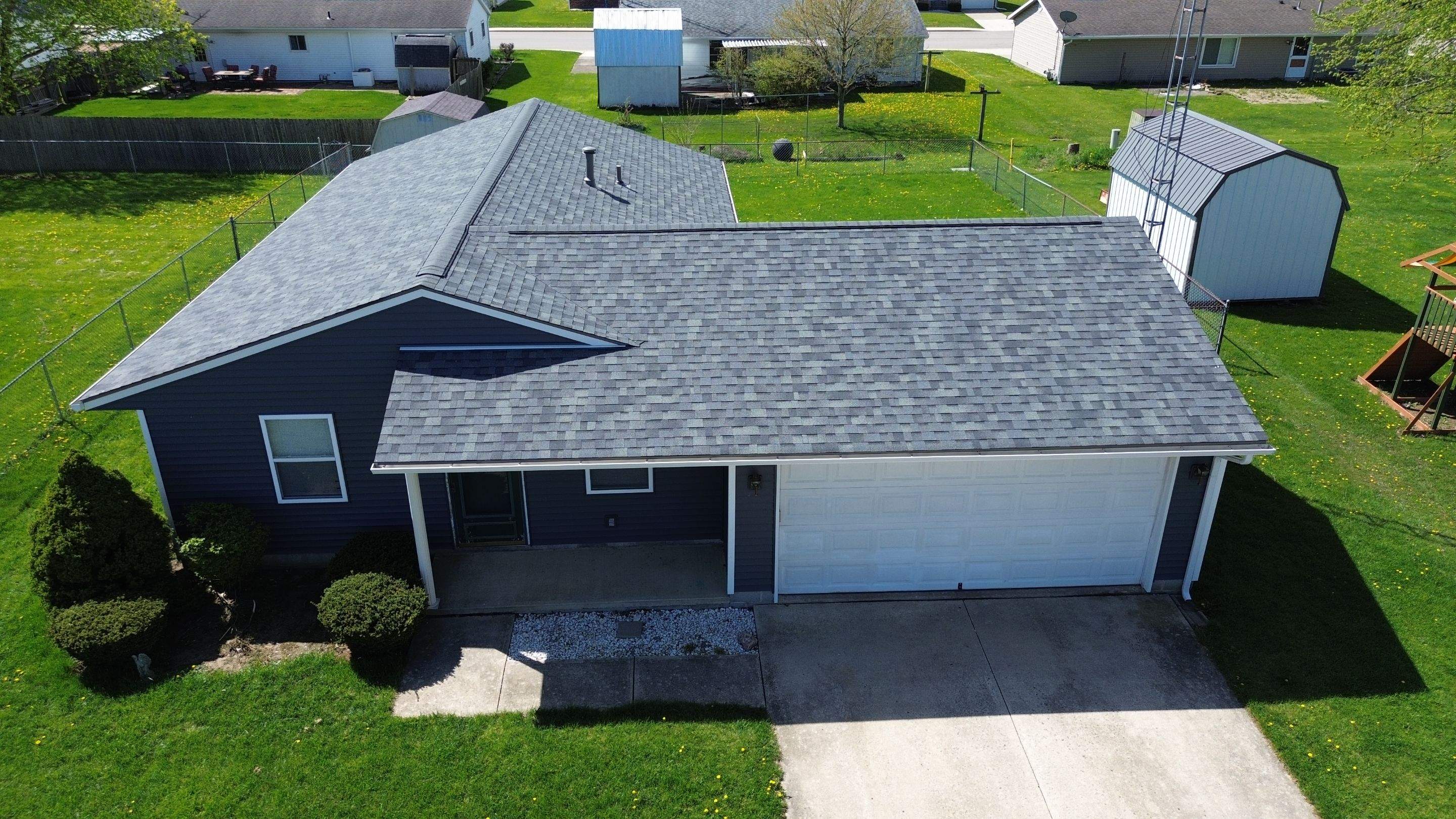 Storm Damage Residential Roof and Siding Installation by WIW Enterprises Inc