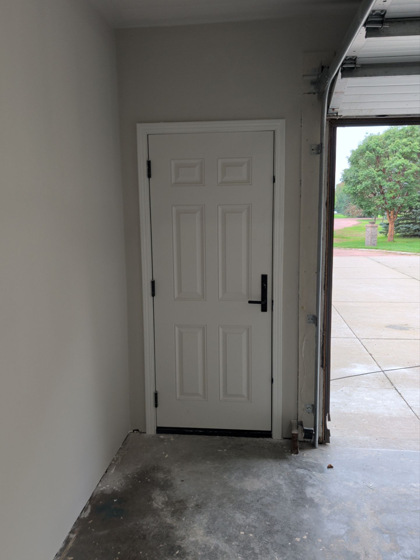 Yankton Garage Remodel with Andersen Window Installation and Drywall by Select Painting, Coatings & Garage Cabinets