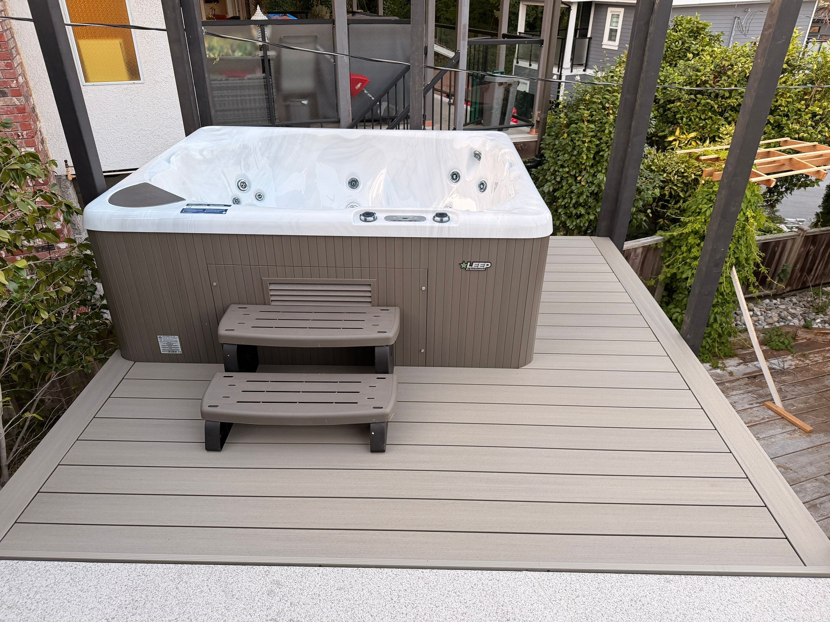 New Composite Deck with glass railing in North Vancouver by YVR Construction Group