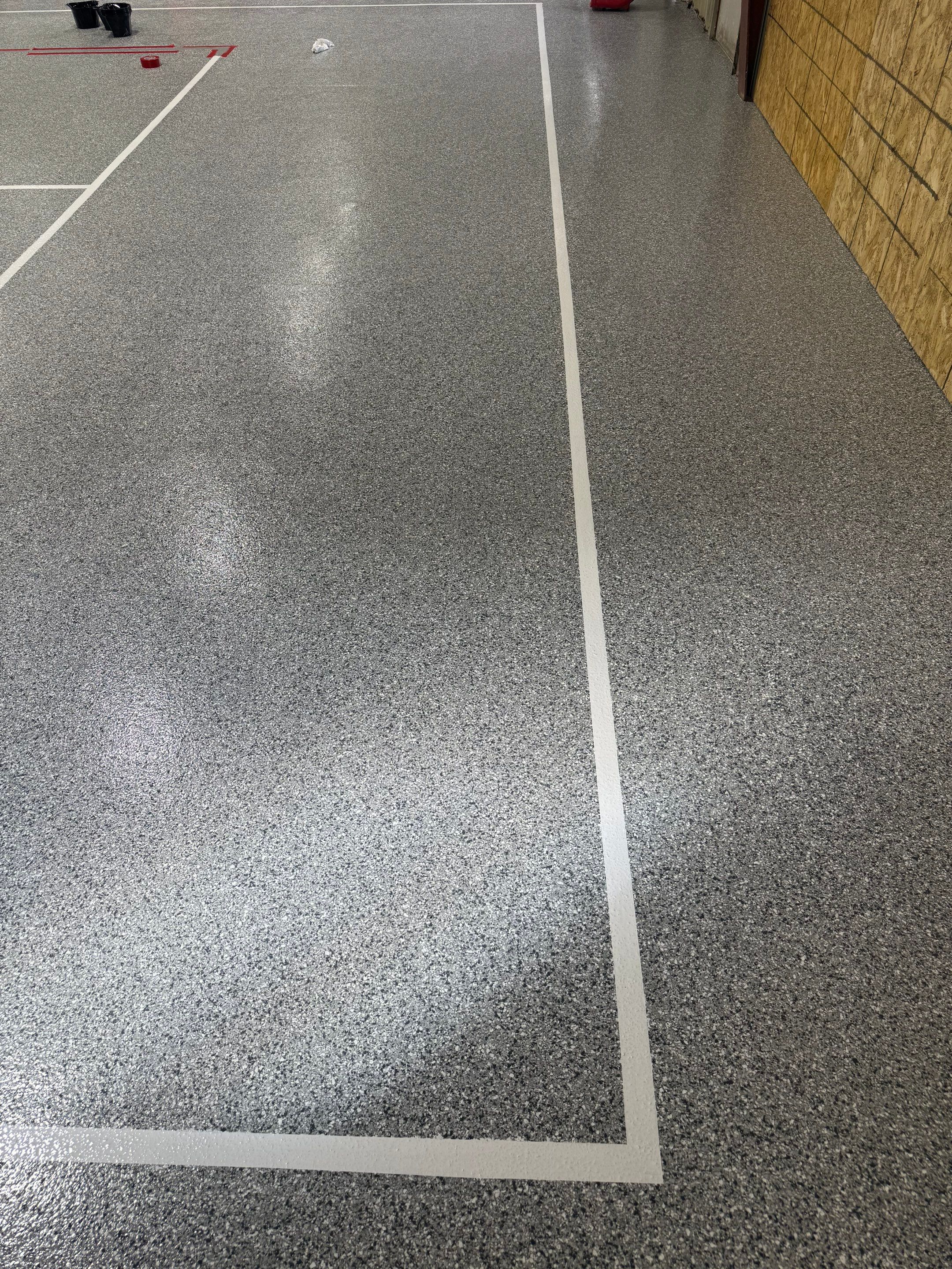 Custom Polyurea Shop Floor with Basketball Court Lines in Rock Valley by Select Painting, Coatings & Garage Cabinets