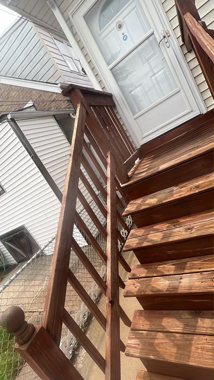 Wood cleaning and staining using Armstrong cloark oil stain by Northern Power Washing LLC.