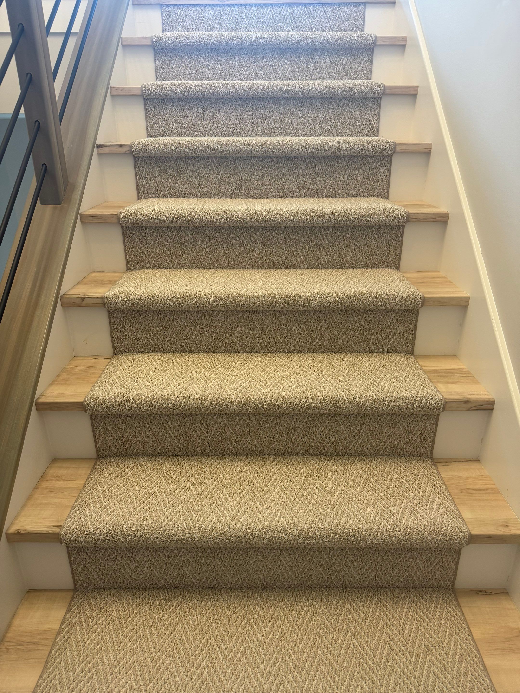 Fishers Staircase Renovation Featuring Custom Herringbone Runner and Modern Railing by Brothers Floor Covering INC.