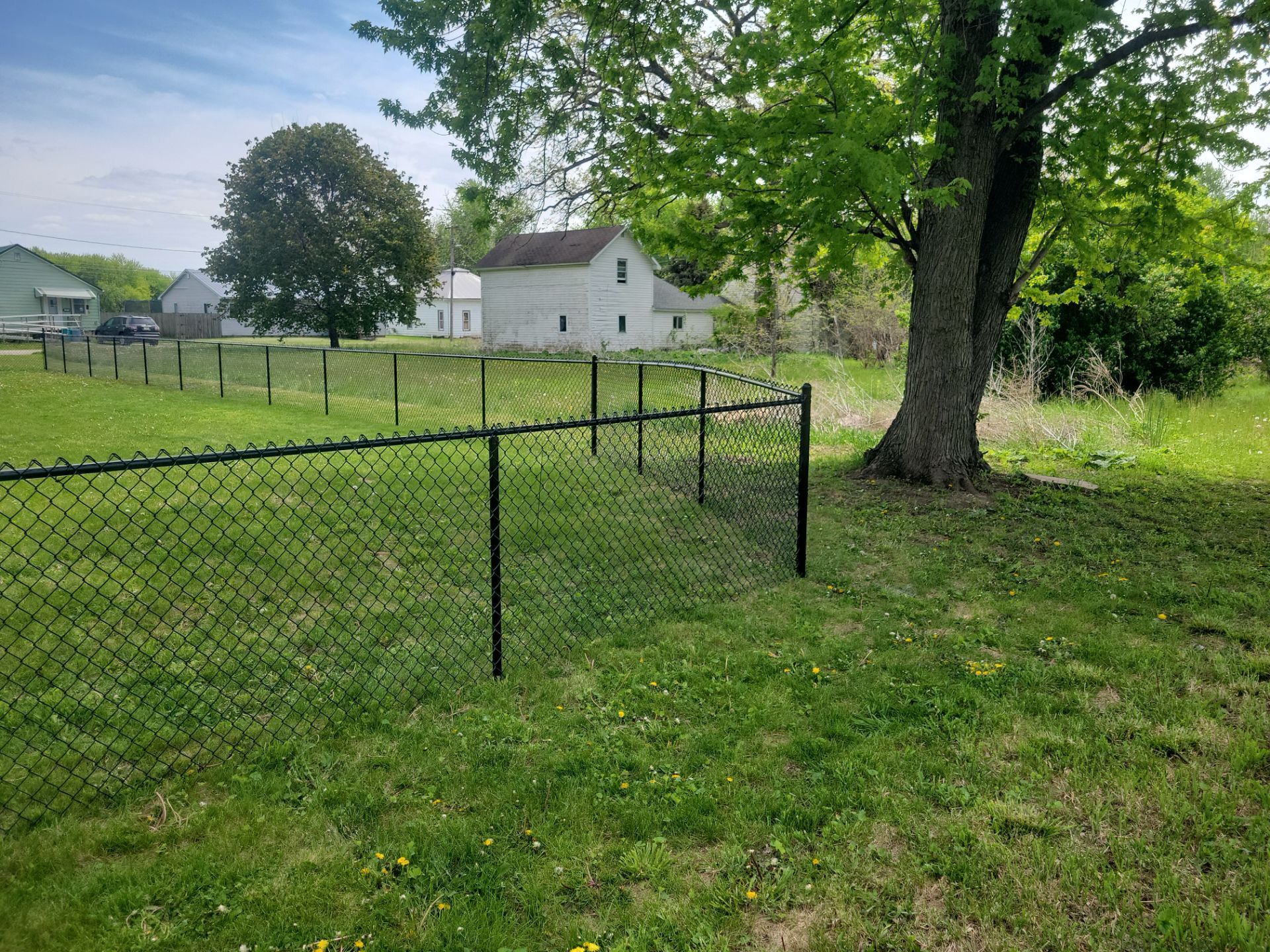 Black Chain Link Fence Installation and Gate in Traer by Perfect Picket Fence and Stain