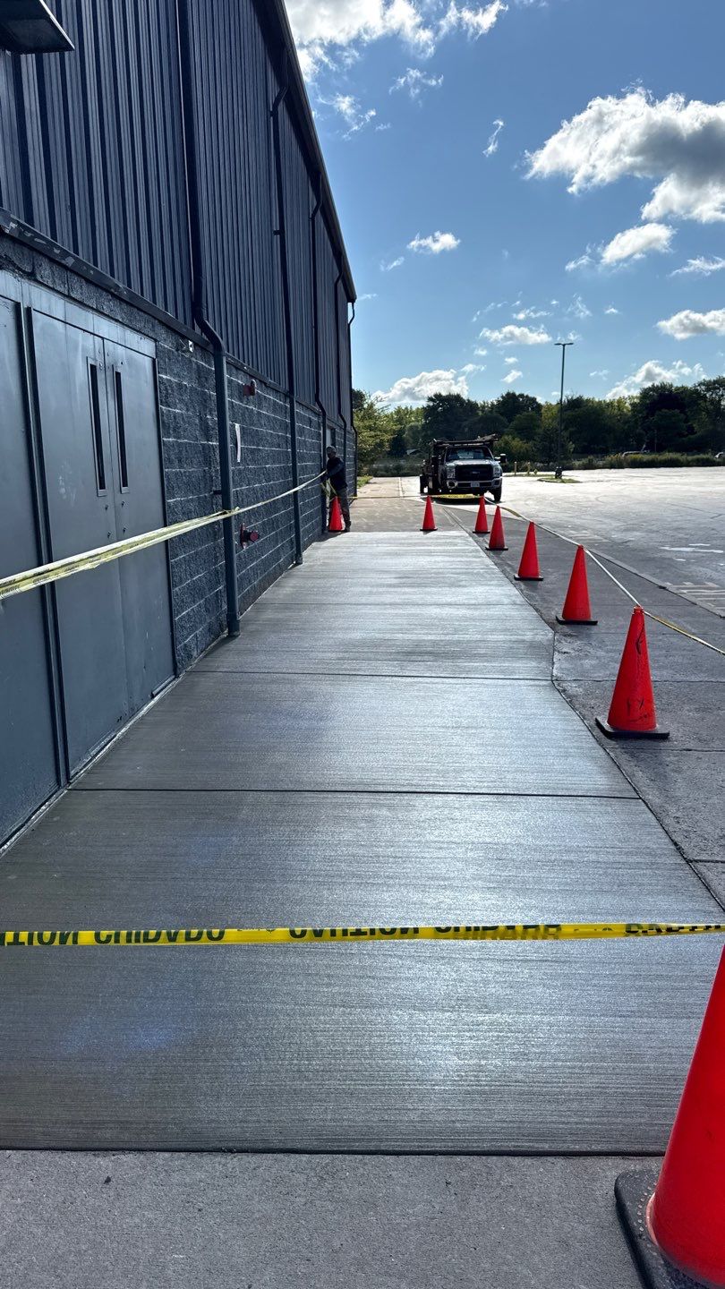 Broom finished concrete patio  by NG Masonry & Construction LLC