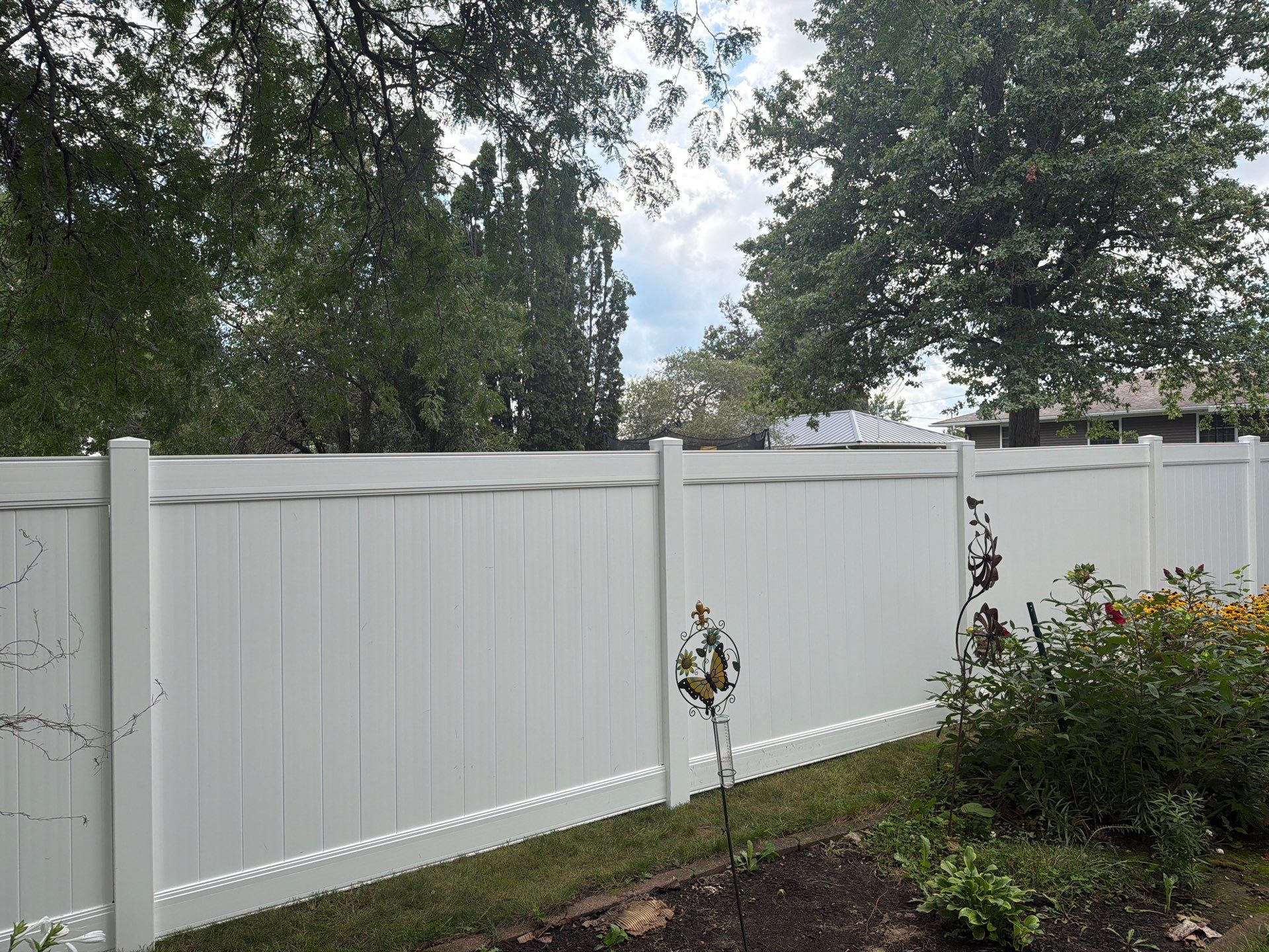 Residential White Vinyl Privacy and Black Chain Link Fencing in Jesup by Perfect Picket Fence and Stain