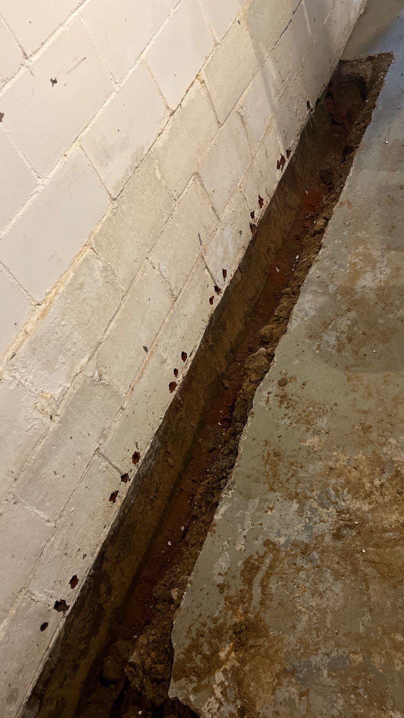 Basement Waterproofing using Drain tile system and a foundation wrap by ACE Waterproofing & Basement Solutions