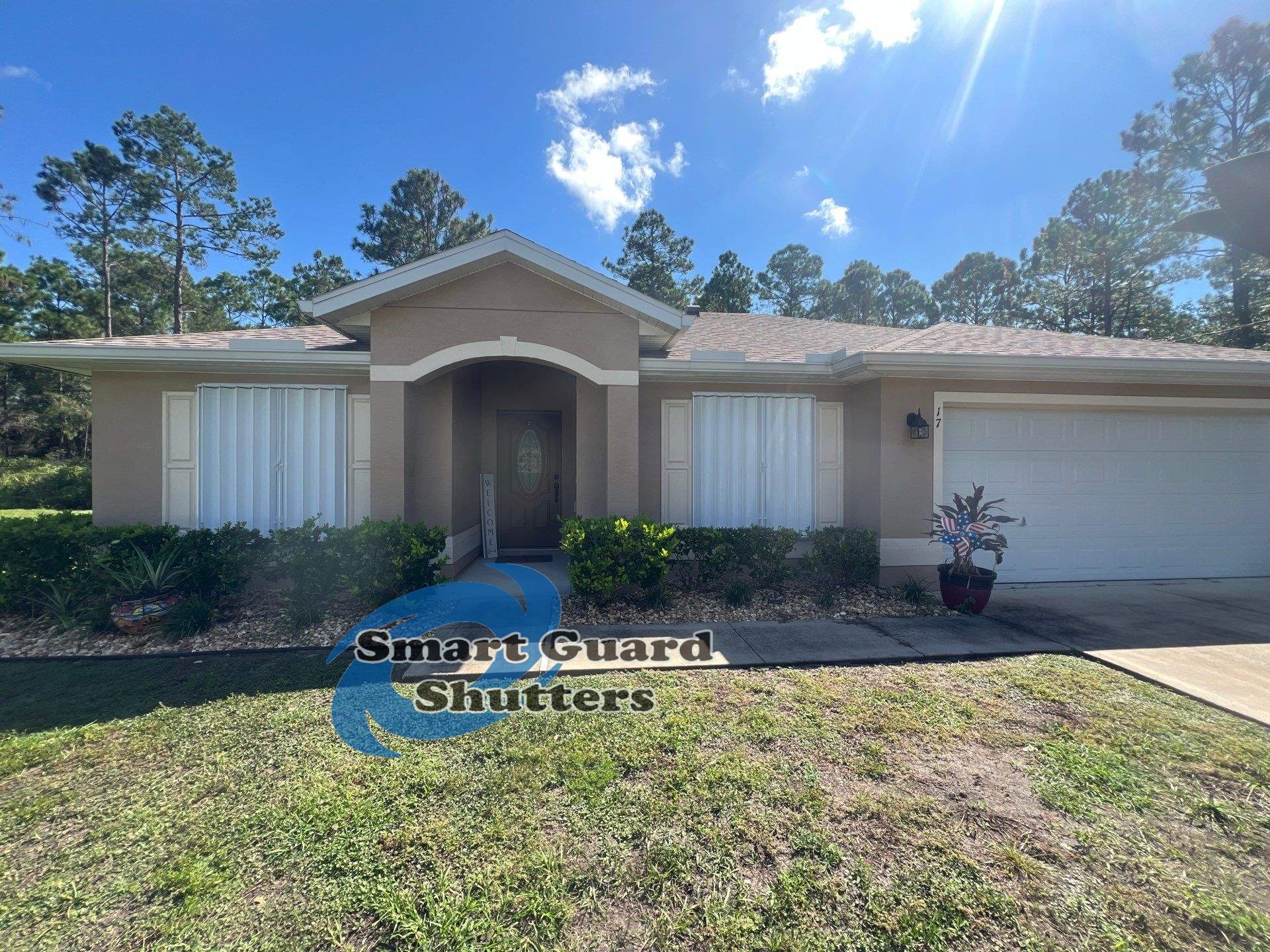 Accordion Shutters in White by Smart Guard Shutters