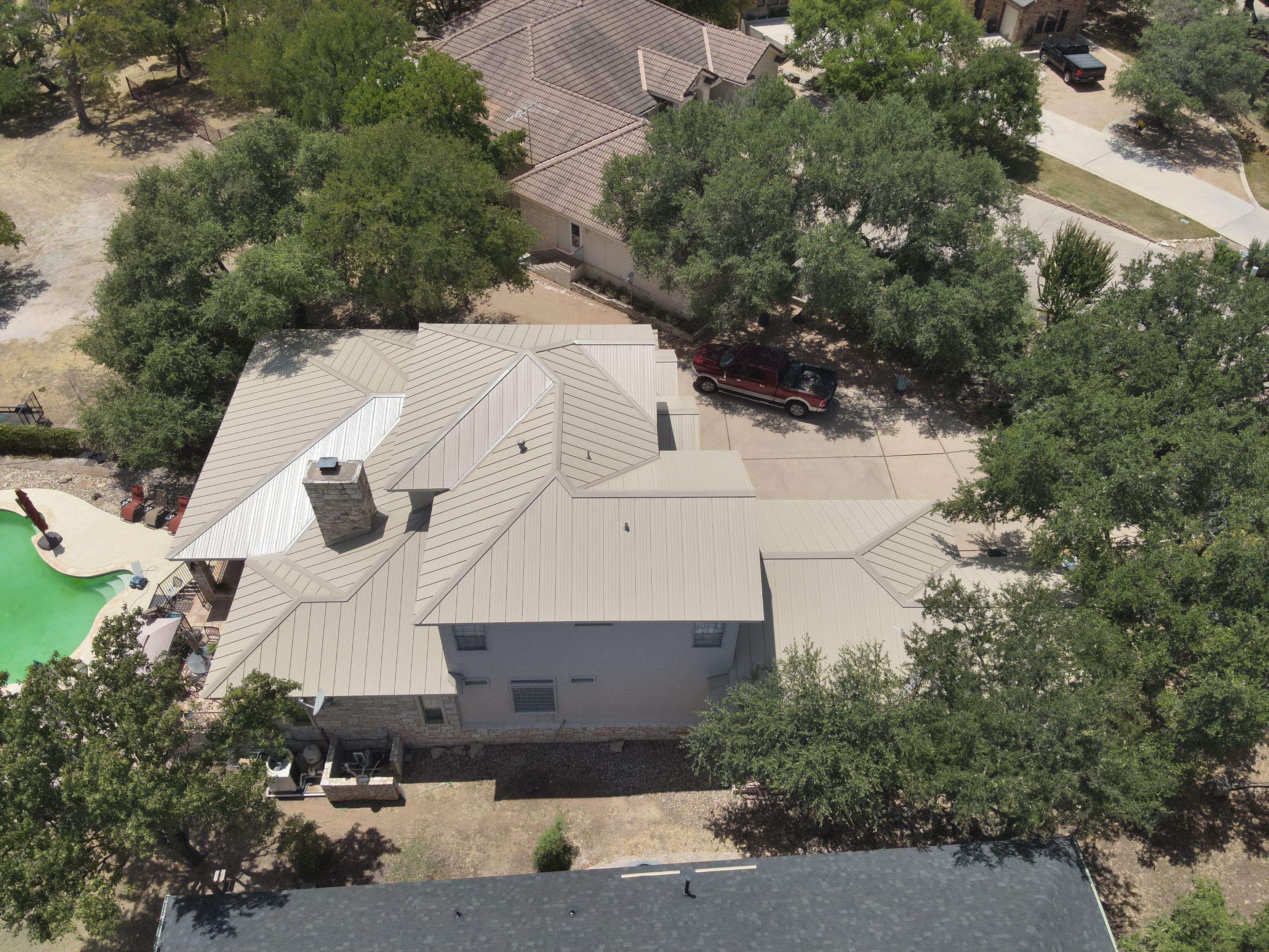 Residential Roof Replacement using 24 GA Double-Lock - Surrey Beige by Action Exteriors Austin