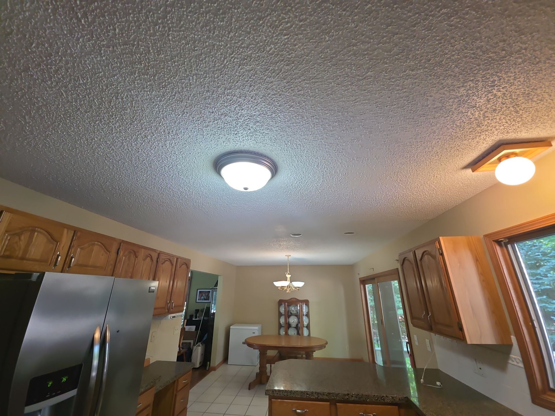 Norton Shores Kitchen Cabinet Painting and Deck Restoration Project by Gordon Painting