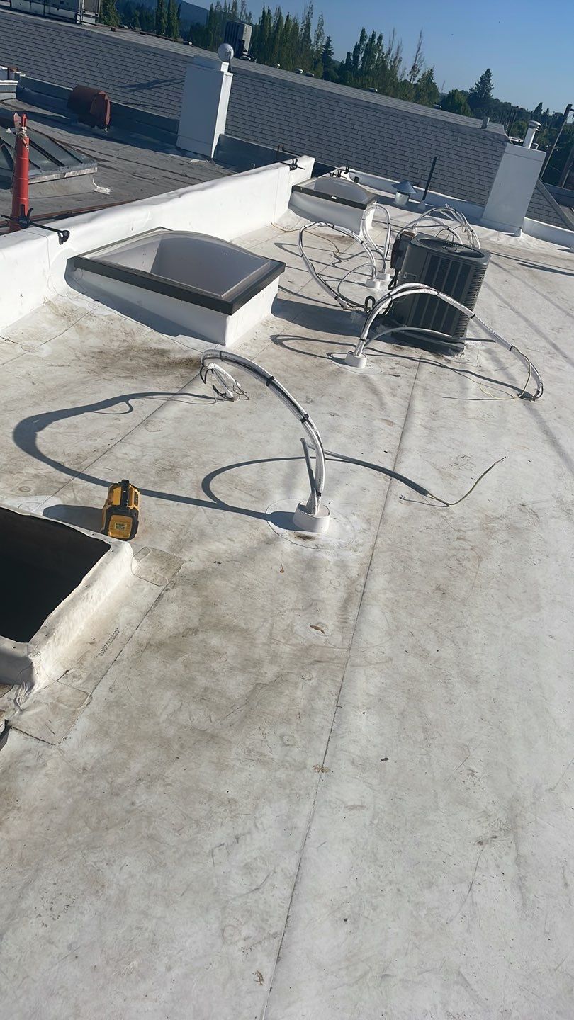 Commercial Flat Roof Installation using GAF 60Mil TPO  by Orezona Building & Roofing Company, Inc.