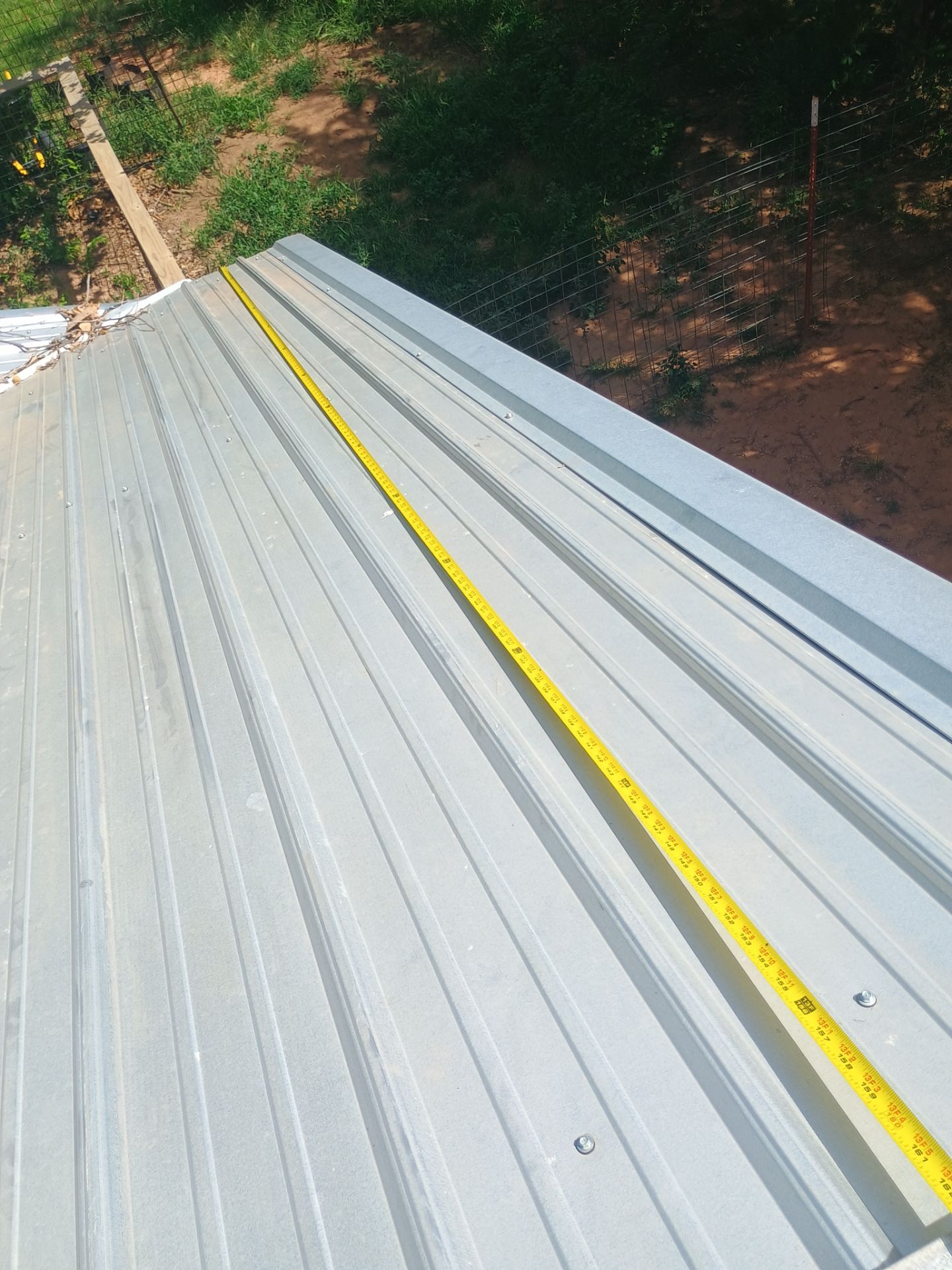 Corrugated Metal Roof Repair for Brick Home in Lindsay by BANA Roofing and Solar Supply