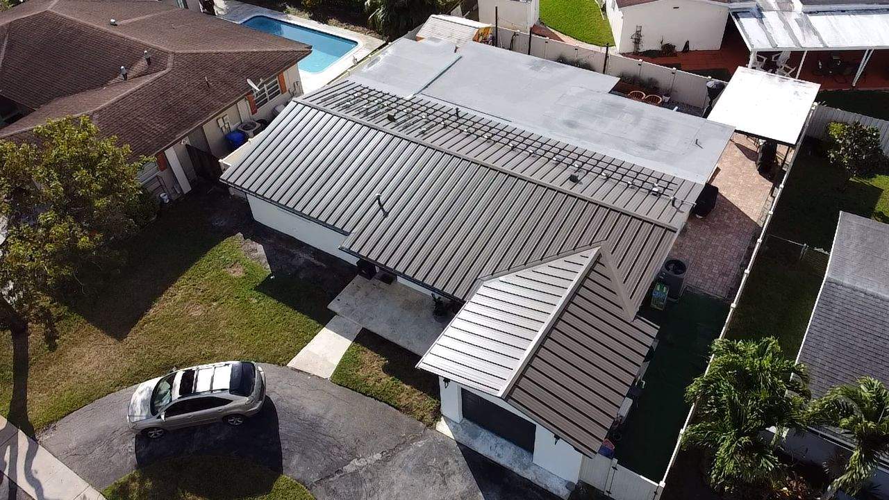 Residential Roofing Installation using Metal Roof  by City Roofing Inc