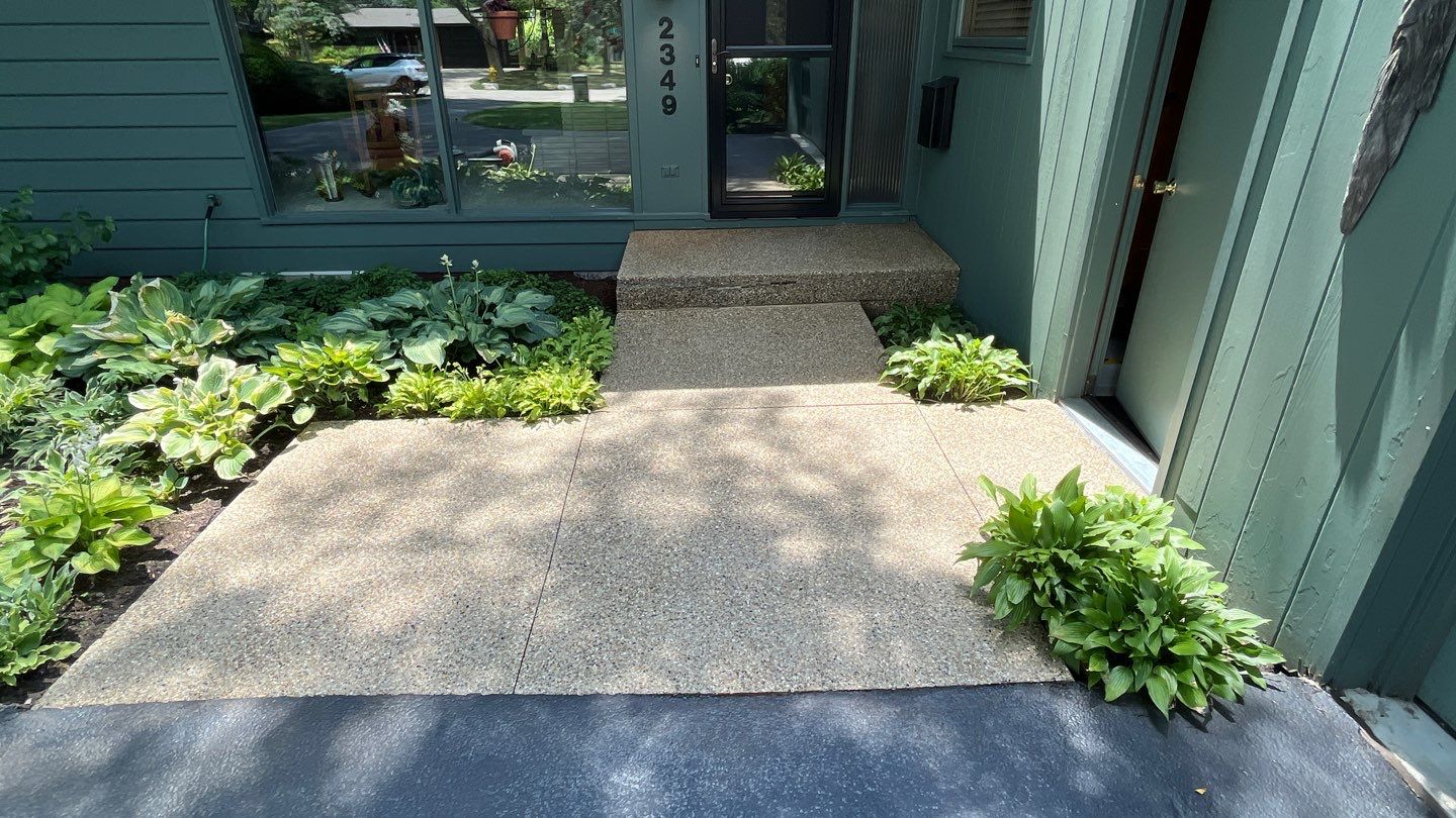 Aggregate concrete cleaning and sealing using Surebond SB-9000 by Northern Power Washing LLC.