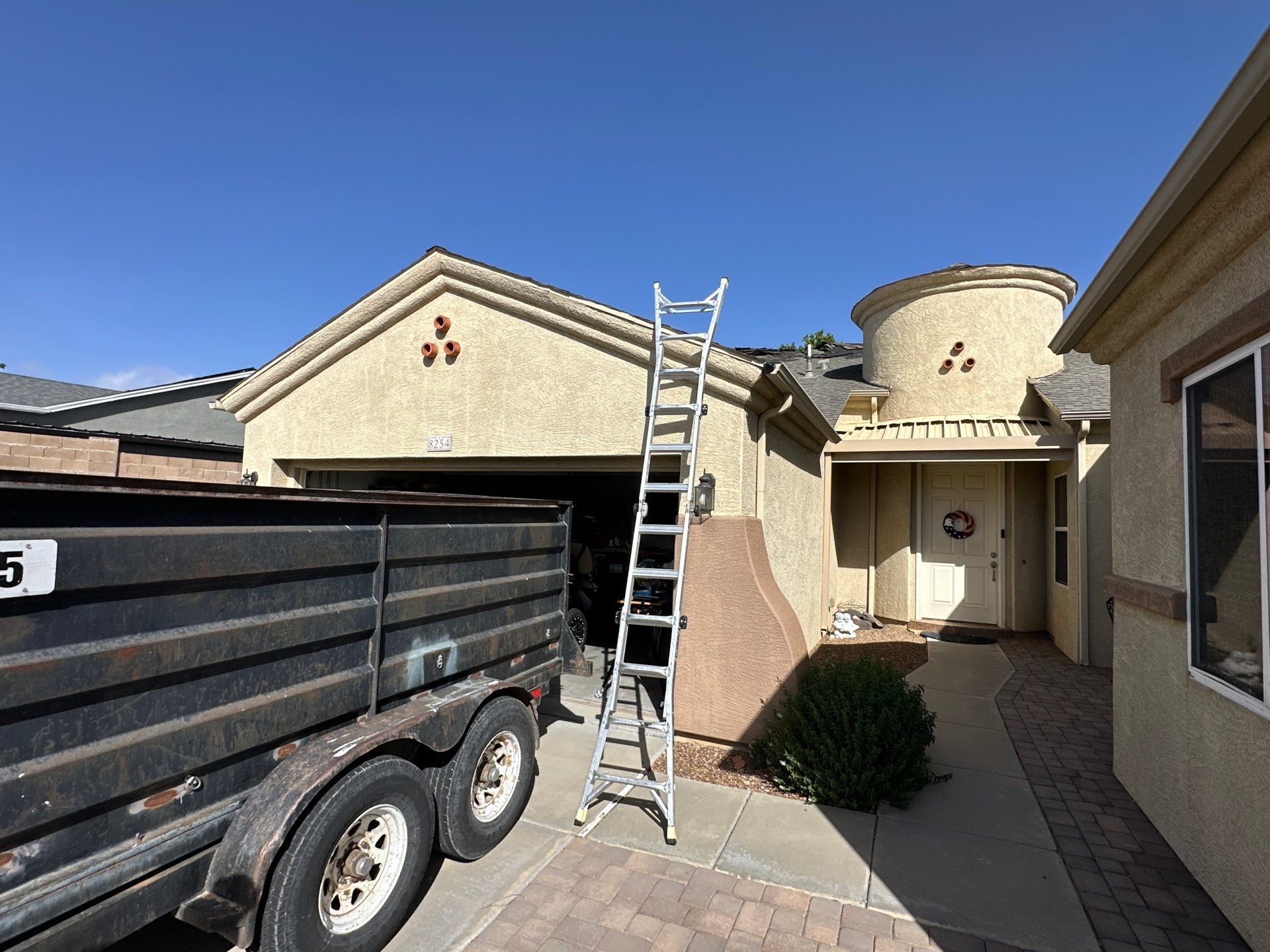 Residential Roofing Installation with Architectural Shingles and Turret Detail by Badger Roofing