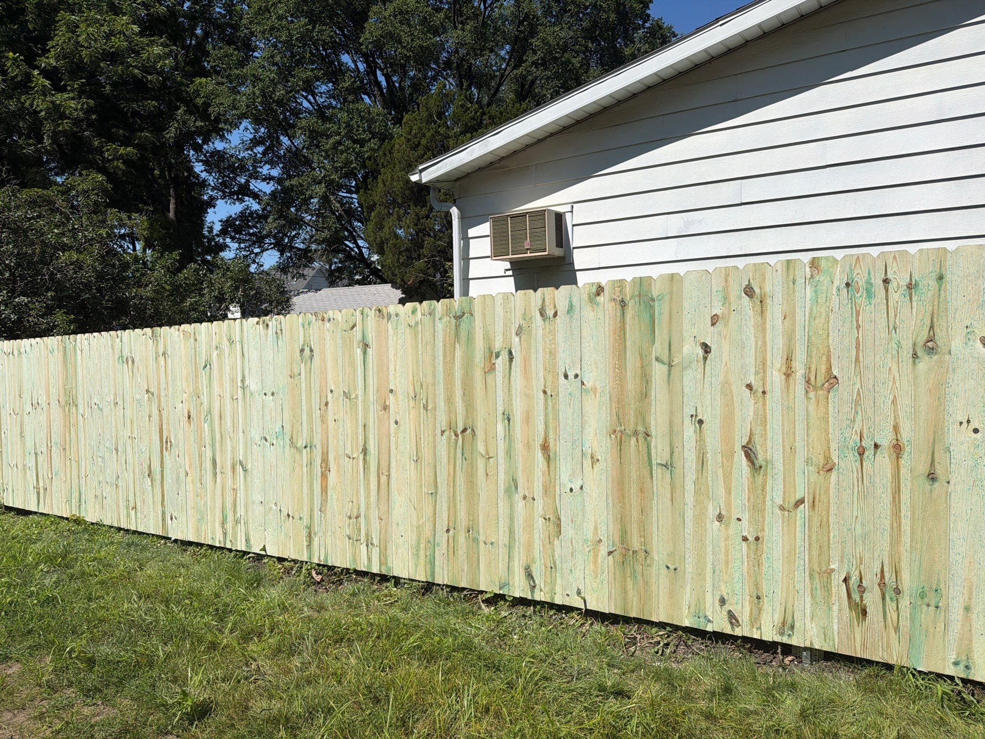 Pressure-Treated Wood Privacy Fence Installation in Waterloo by Perfect Picket Fence and Stain