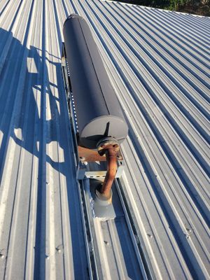 Wide angle view of standing seam metal roof installation