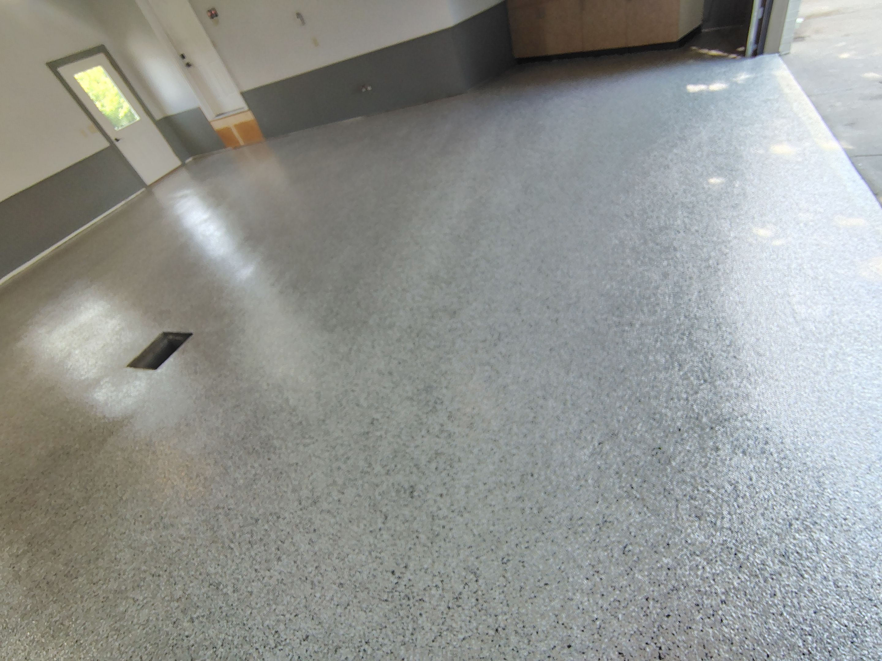 Multi-Fleck Epoxy Garage Floor Coating in Dell Rapids by Select Painting, Coatings & Garage Cabinets
